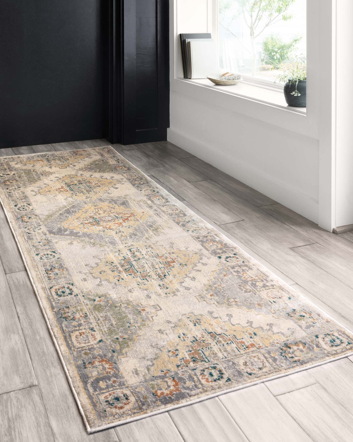 Oatmeal and silver transitional rug with rectangular medallion motifs and muted blue accents