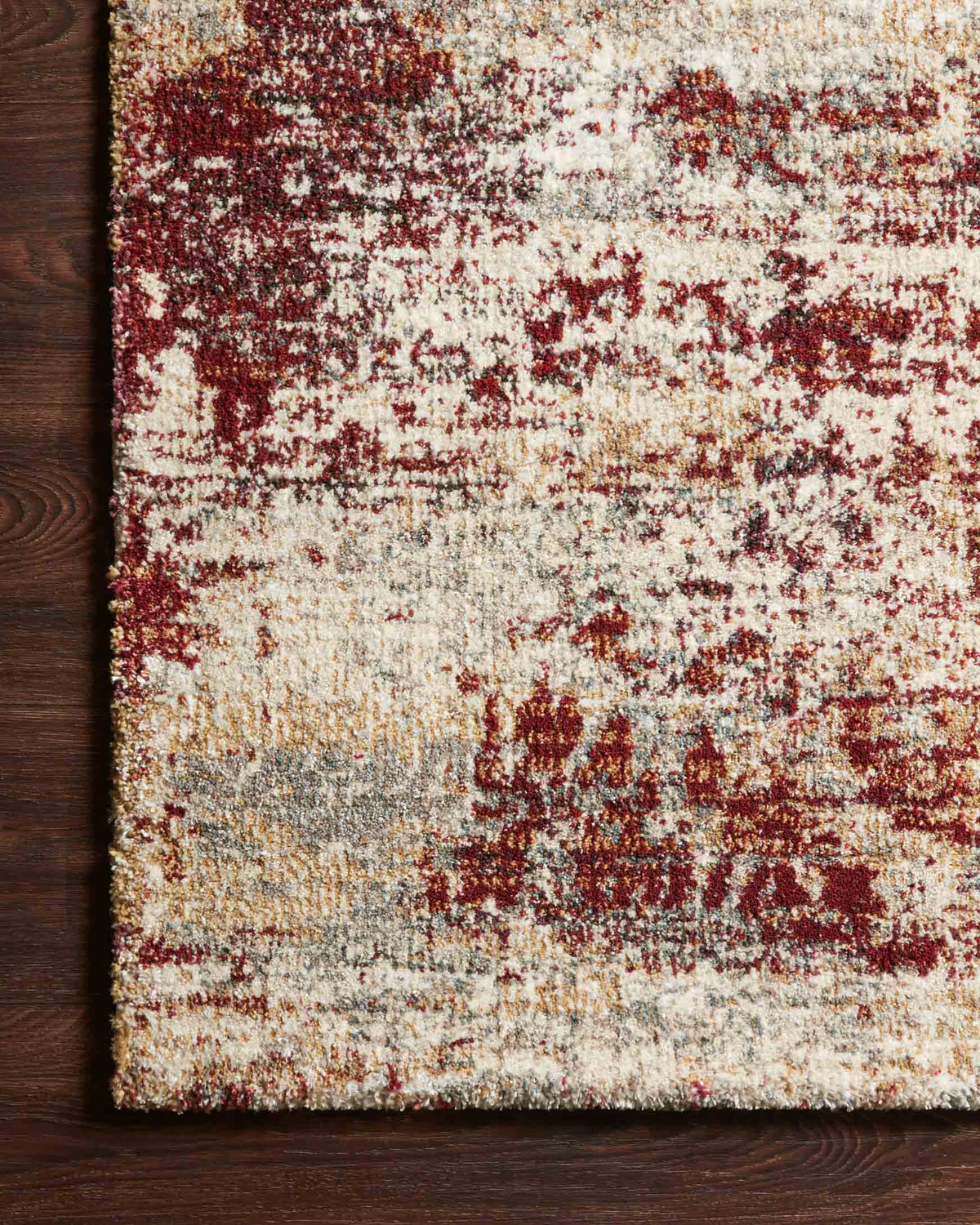 Contemporary power-loomed rug in cream and rust, distressed motif and textured surface