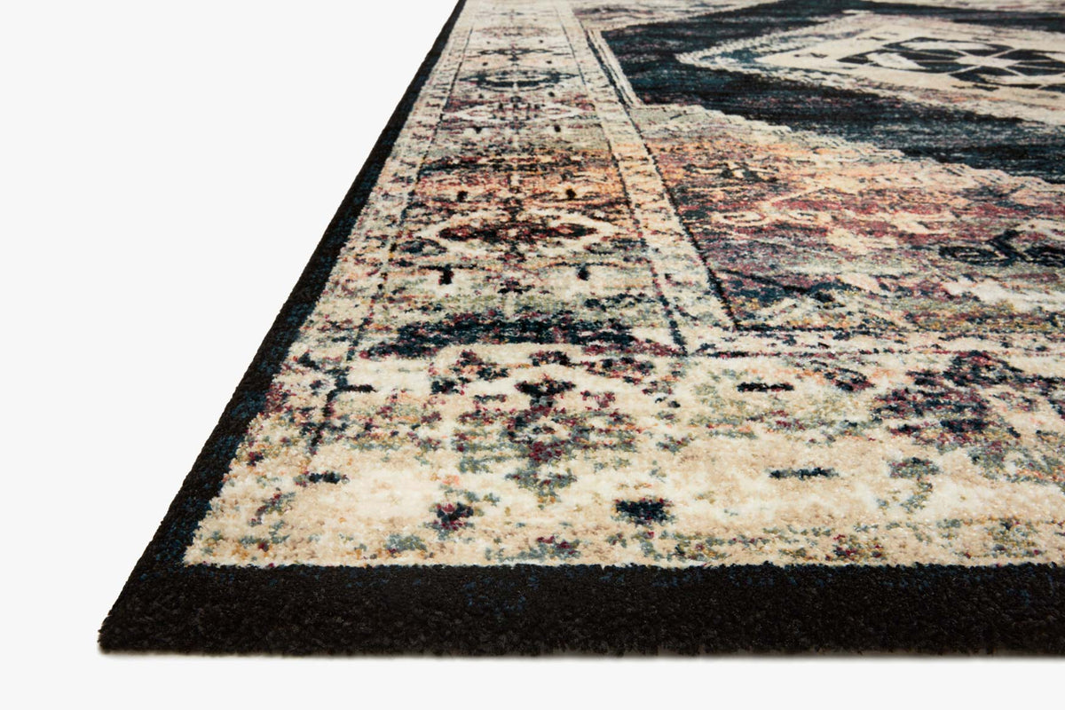 Geometric rug corner with cream center bands, dark ink border, and rust speckled accents