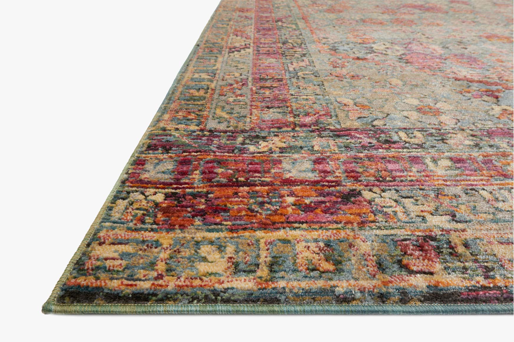 Corner of contemporary rug in slate and berry with multicolor border detail