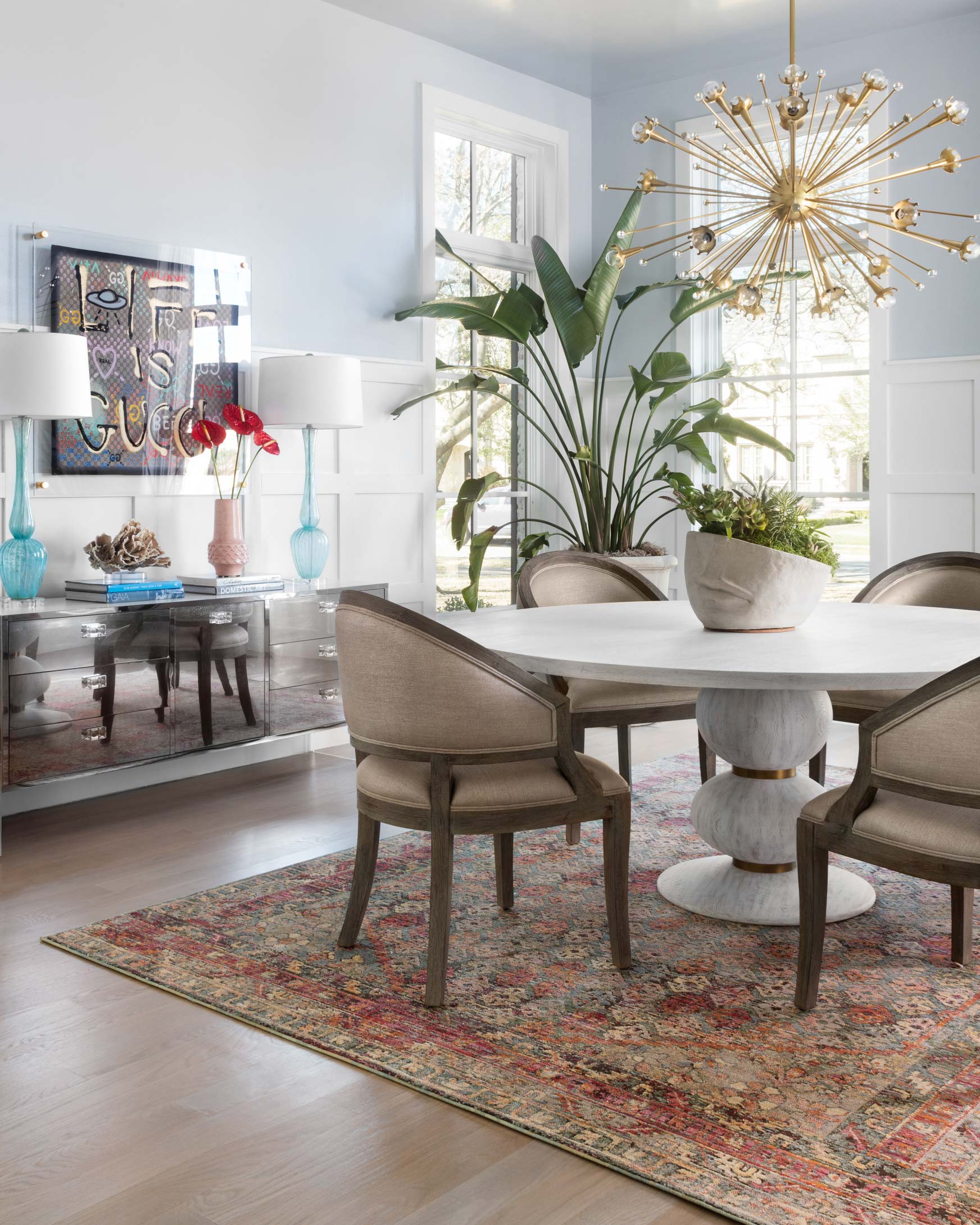 Multicolor geometric contemporary rug in slate and berry, shown in a living room