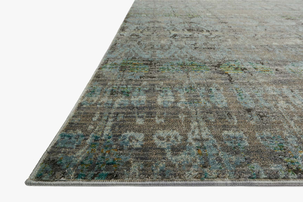 Contemporary power-loomed rug in steel and lagoon, distressed abstract pattern with angled view