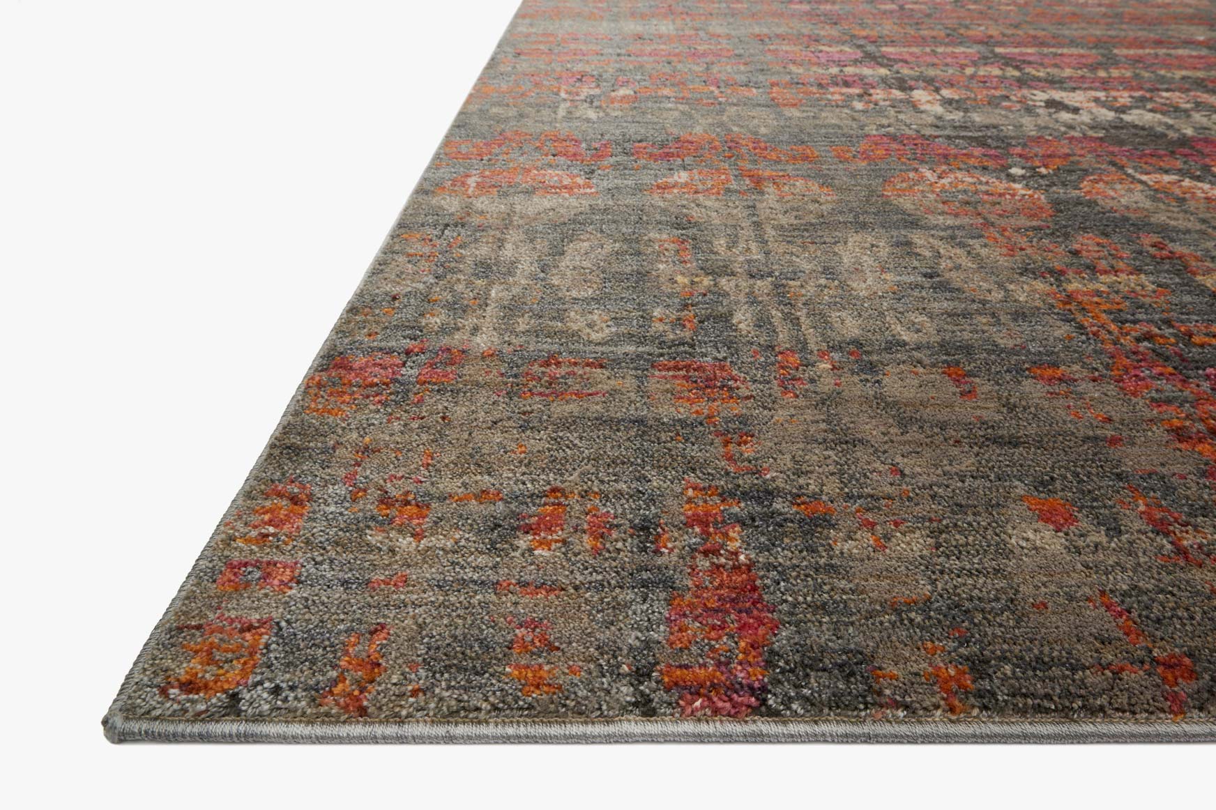 Contemporary power-loomed rug angled view with textured pile and steel gray rust accents