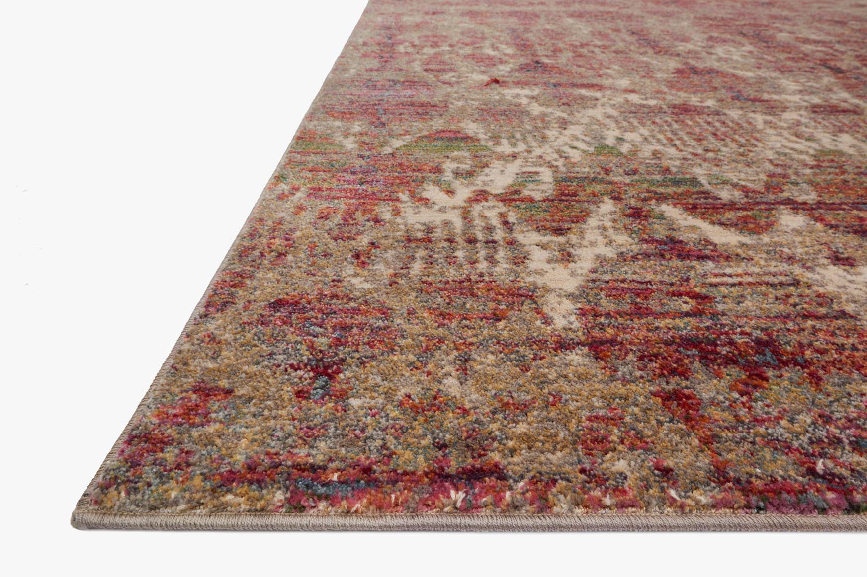 Contemporary rug corner with cream base, berry red speckles, and distressed abstract motif