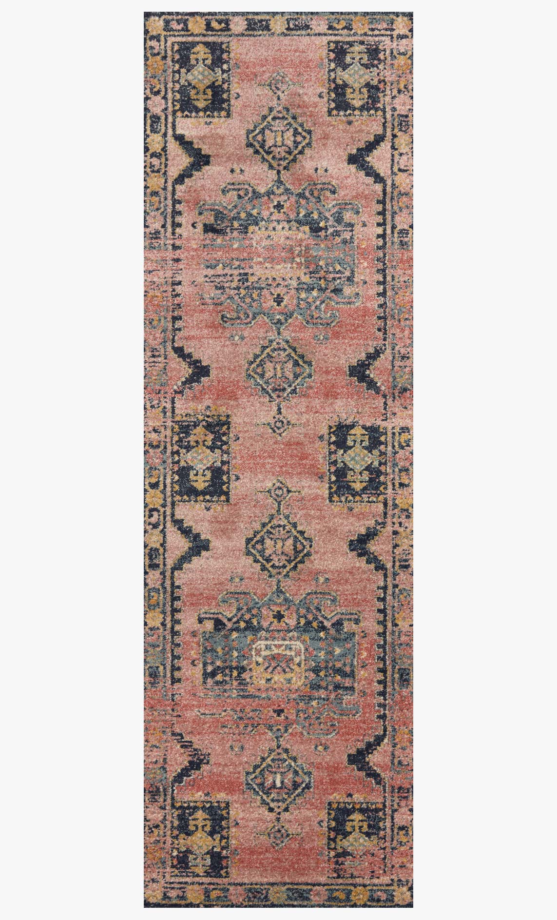 Transitional power-loomed rug, rose pink and navy with repeating geometric medallions.