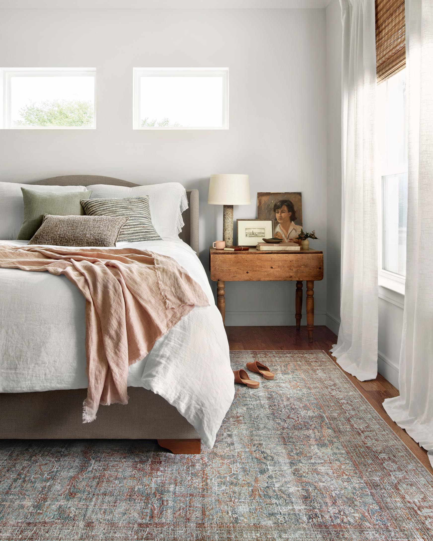 Rectangular rug with distressed motif in lagoon blue and brick accents