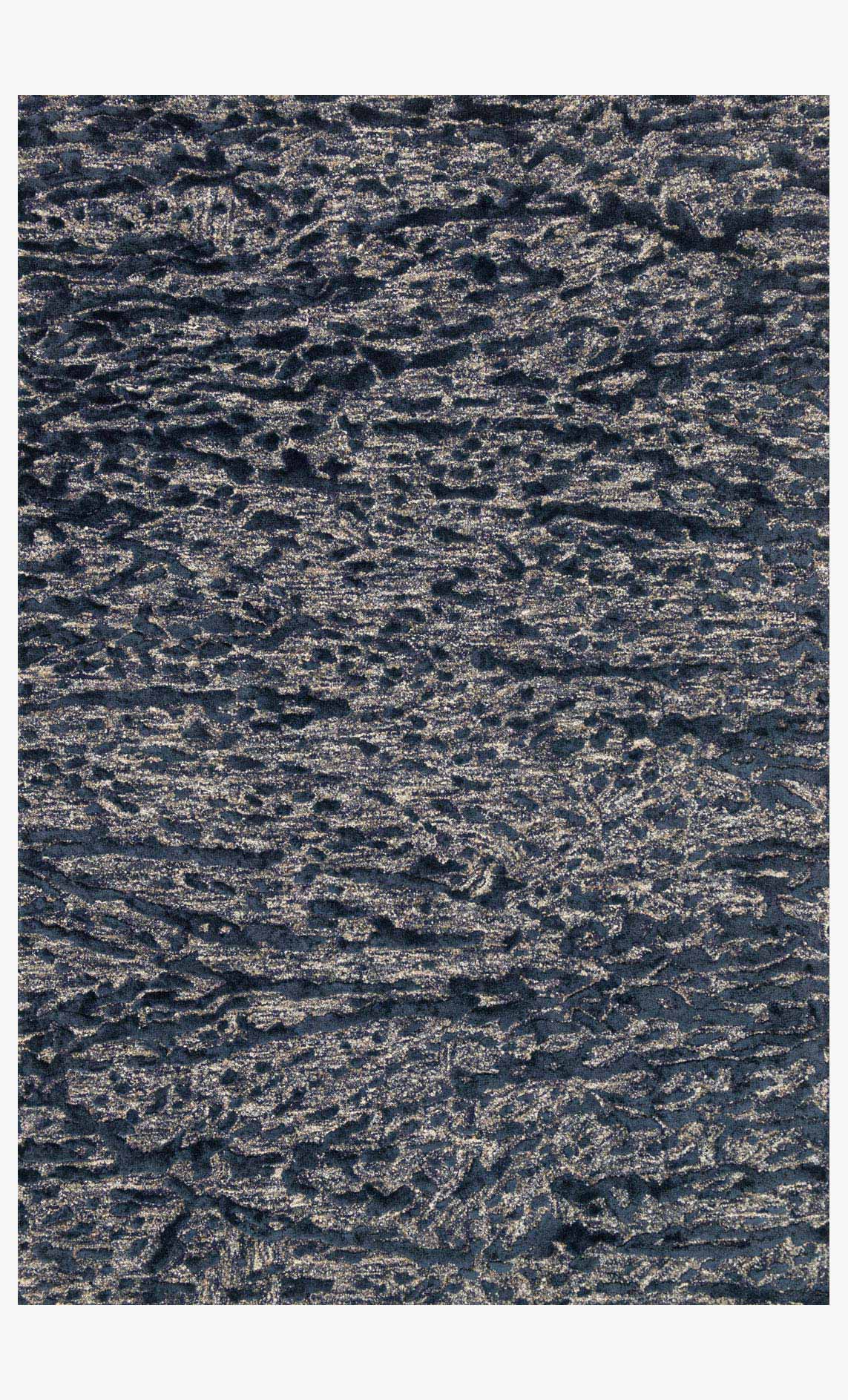 Hand-tufted area rug with steel and blue textured pattern, dense short pile.