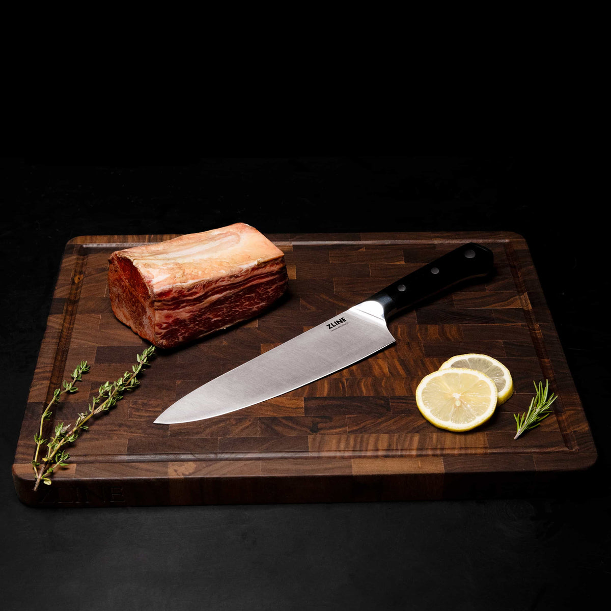 Chef’s knife on wooden cutting board with stainless blade and black dotted handle