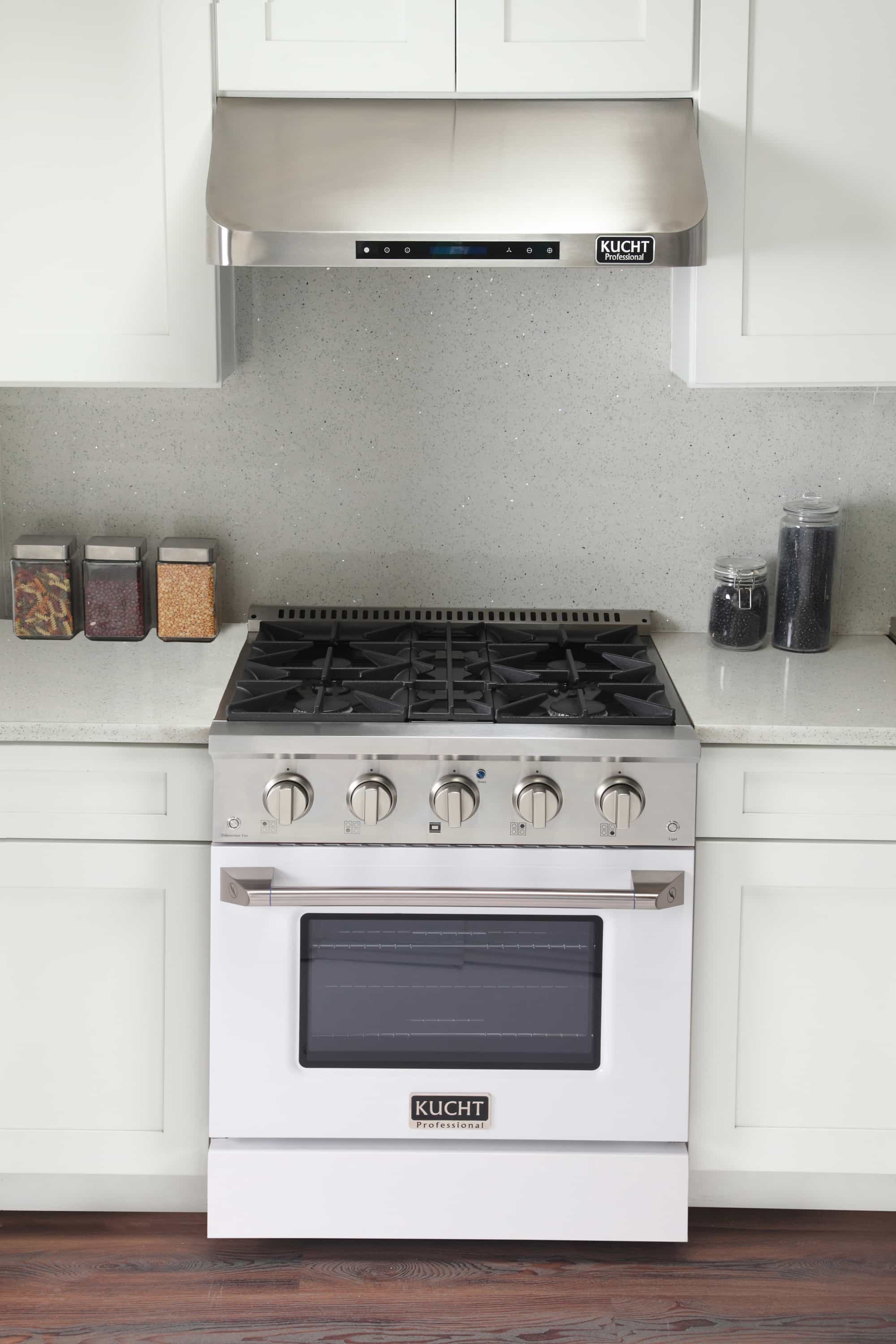 Kucht pro-style dual fuel range front with black cooktop grates and dark oven window