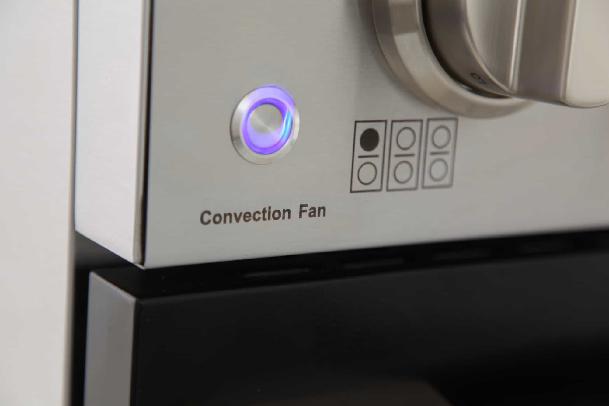 Stainless steel oven control panel with convection fan button and circular controls