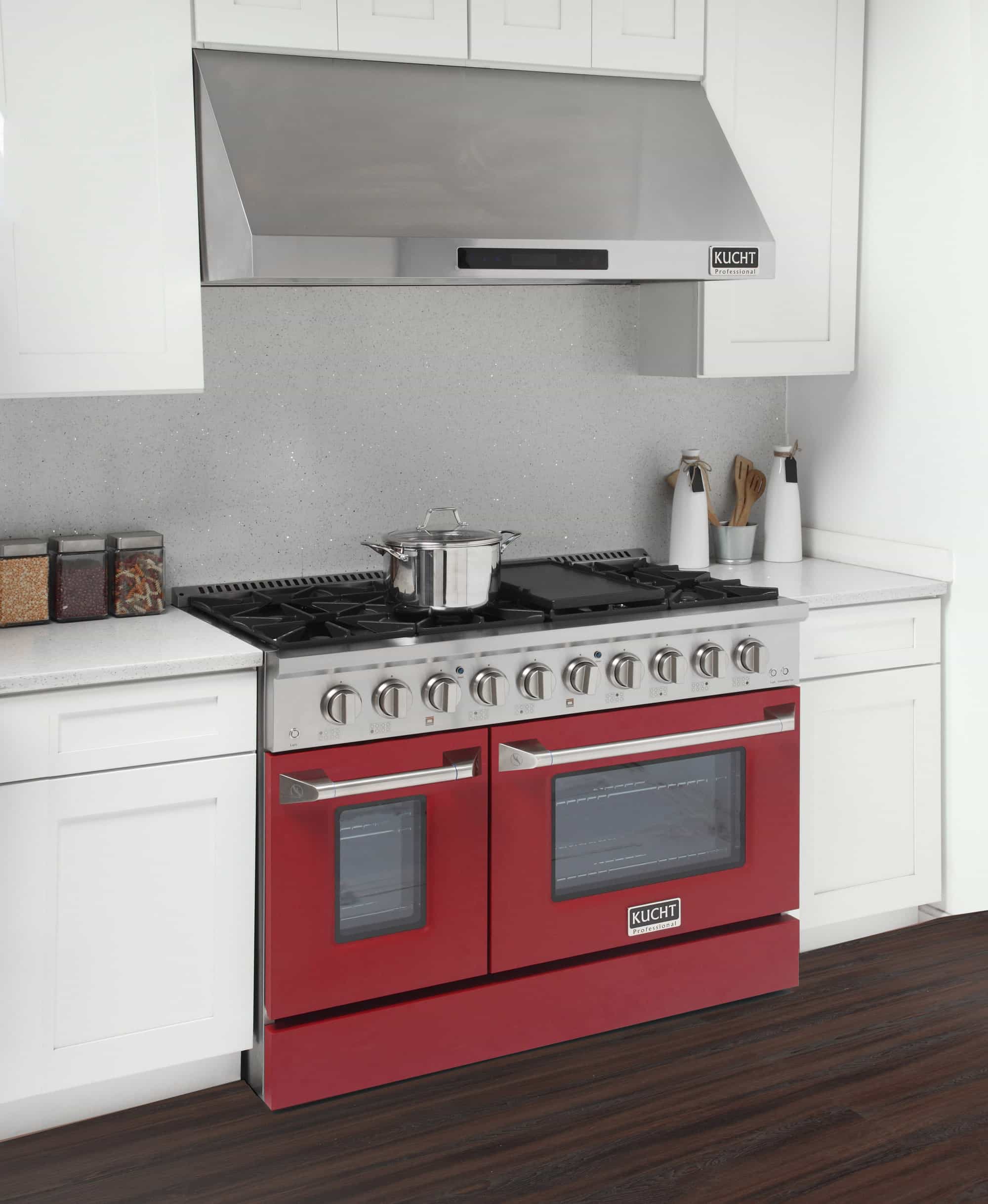 Stainless dual fuel range with red oven doors, front burners, and control knobs