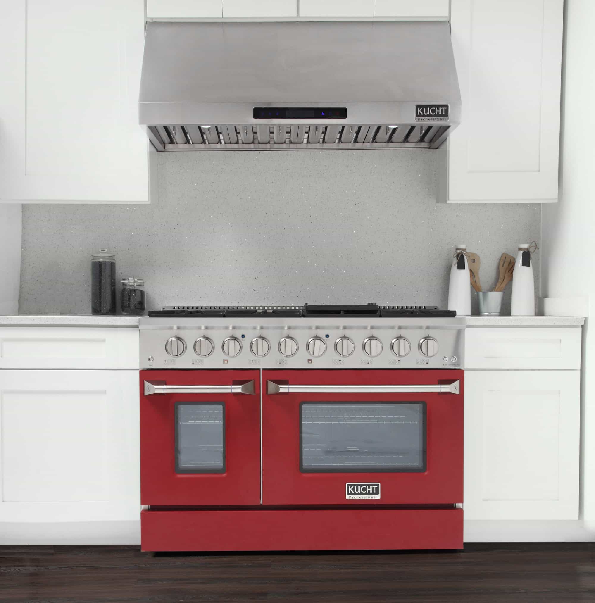 Dual fuel range in stainless with red oven doors and a front row of control knobs