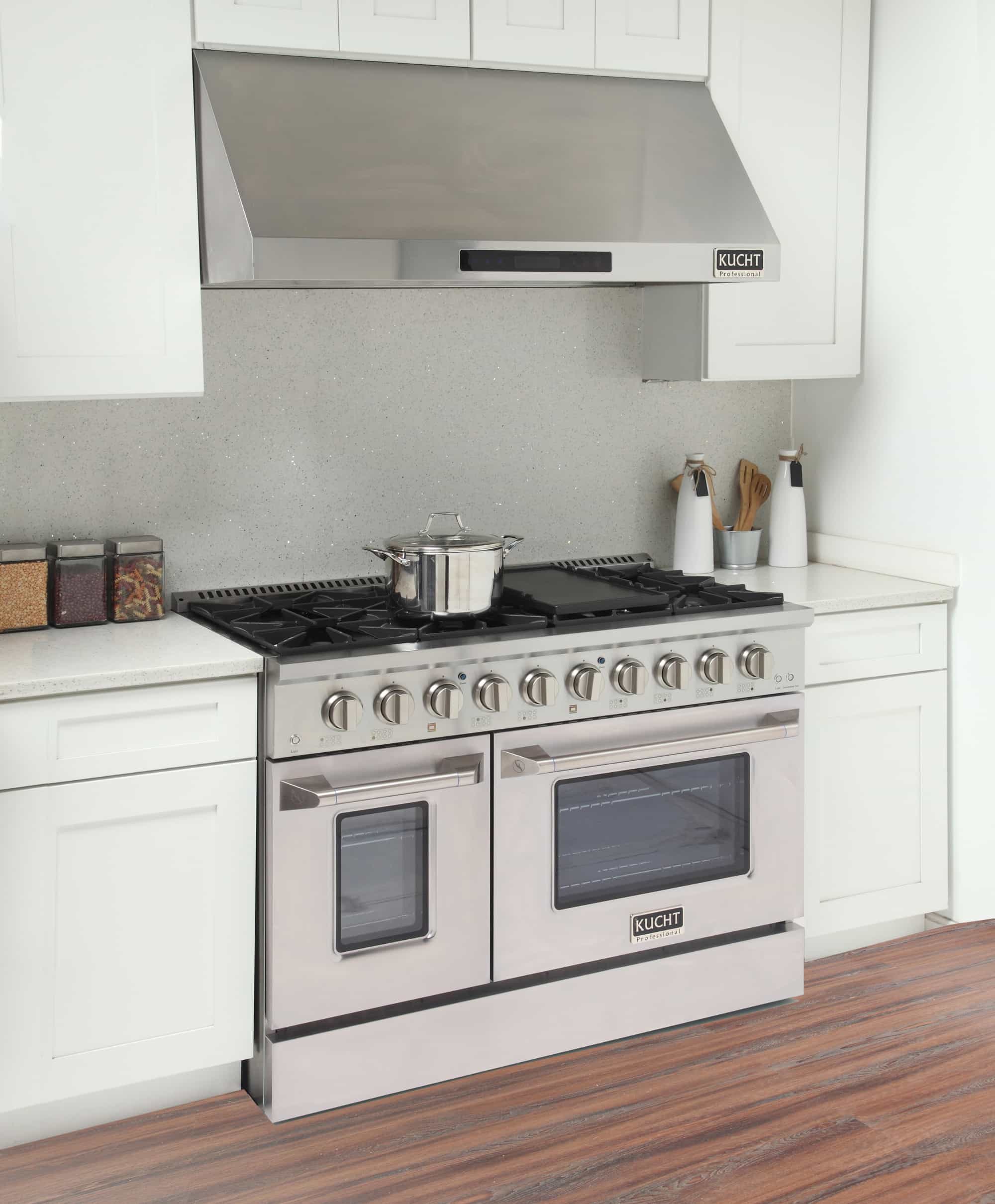 Stainless steel Kucht dual fuel range with cooktop grates and double ovens
