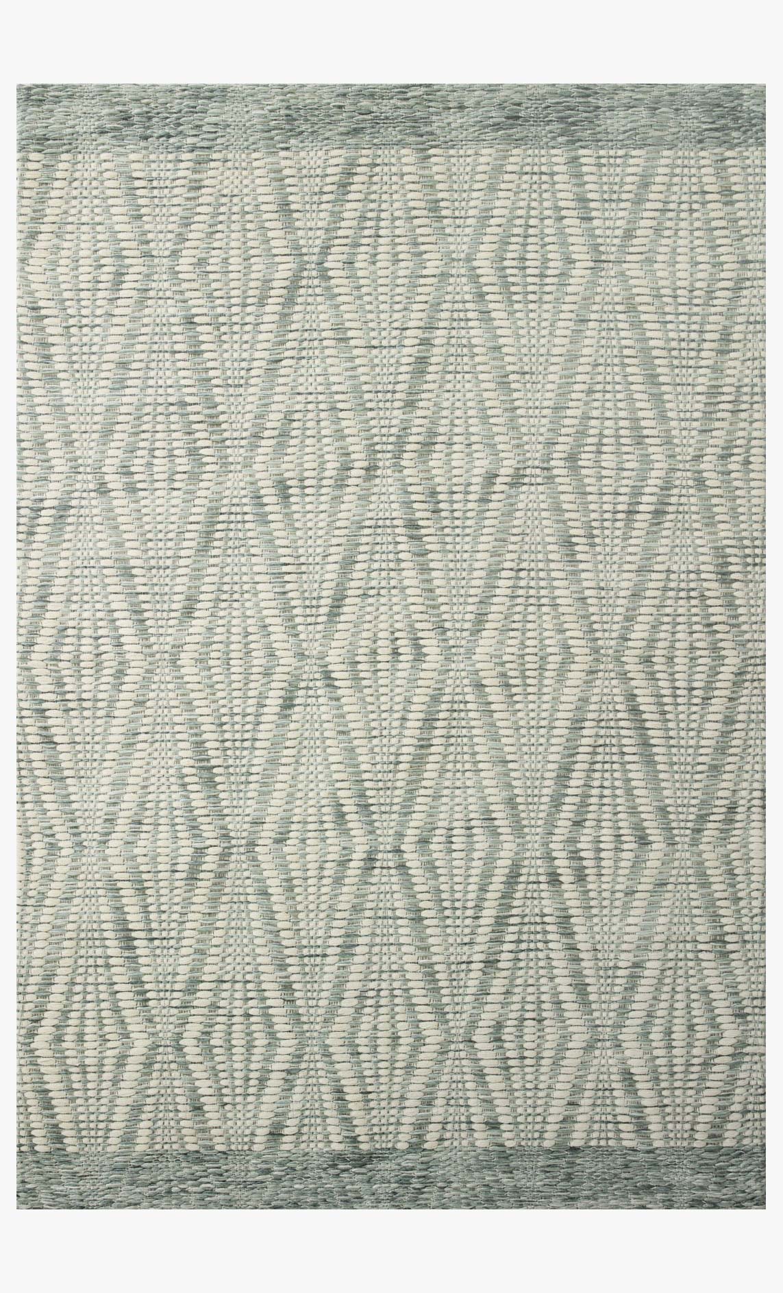 Hand-woven area rug in ivory and sage with geometric diamond pattern, flat weave.