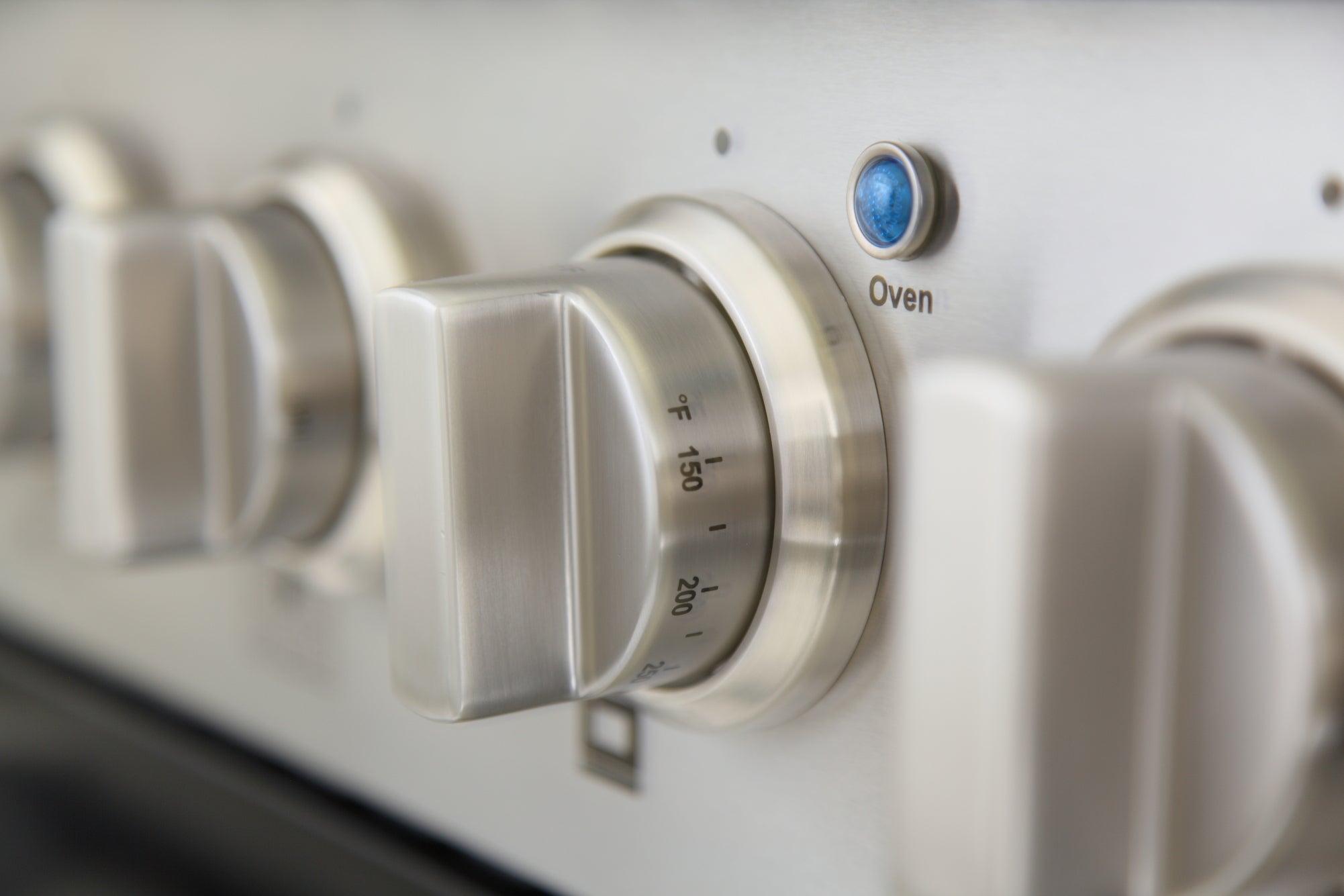 Stainless dual fuel range control knob with temperature markings
