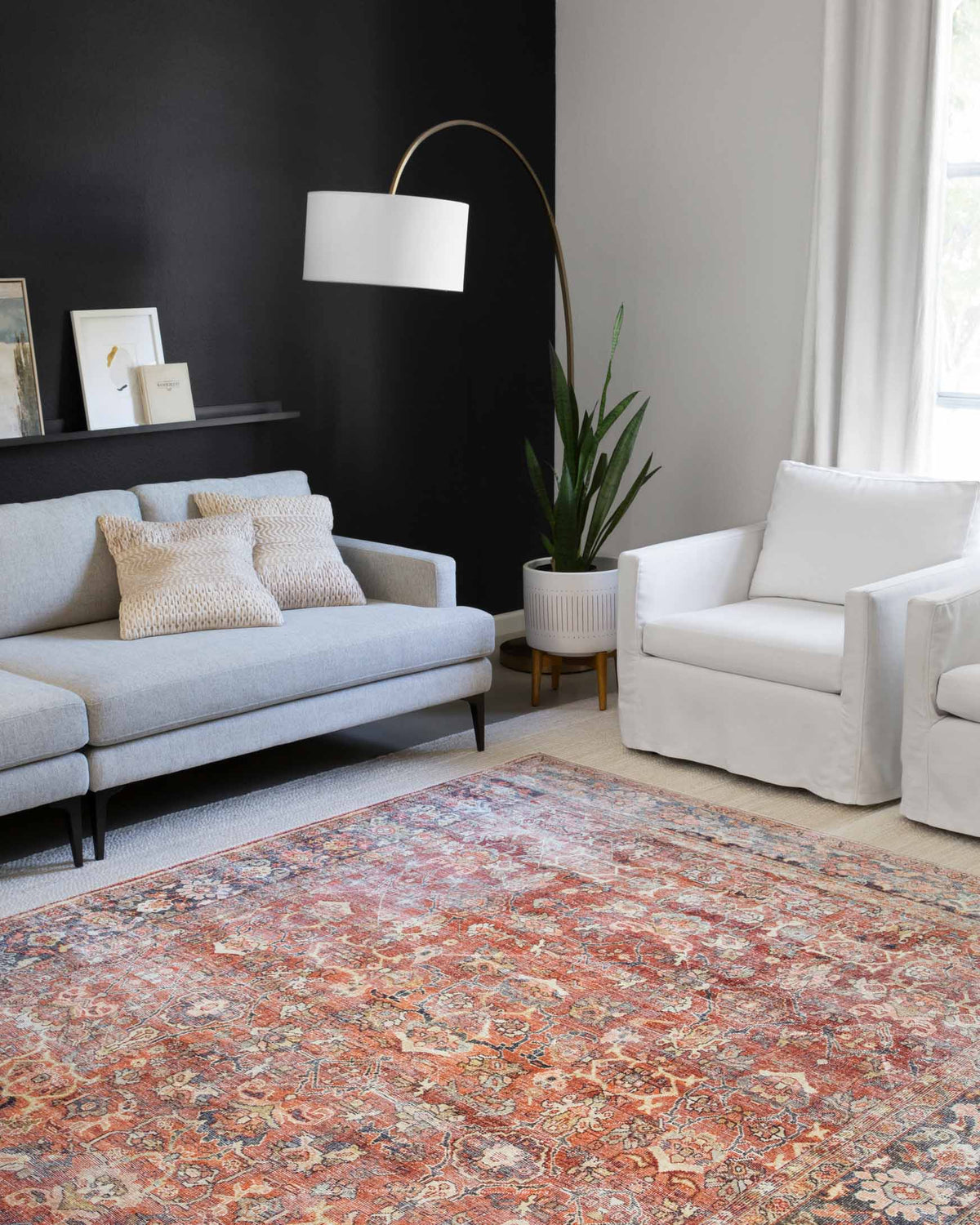 Spice-and-marine Persian-style area rug with distressed medallion and border