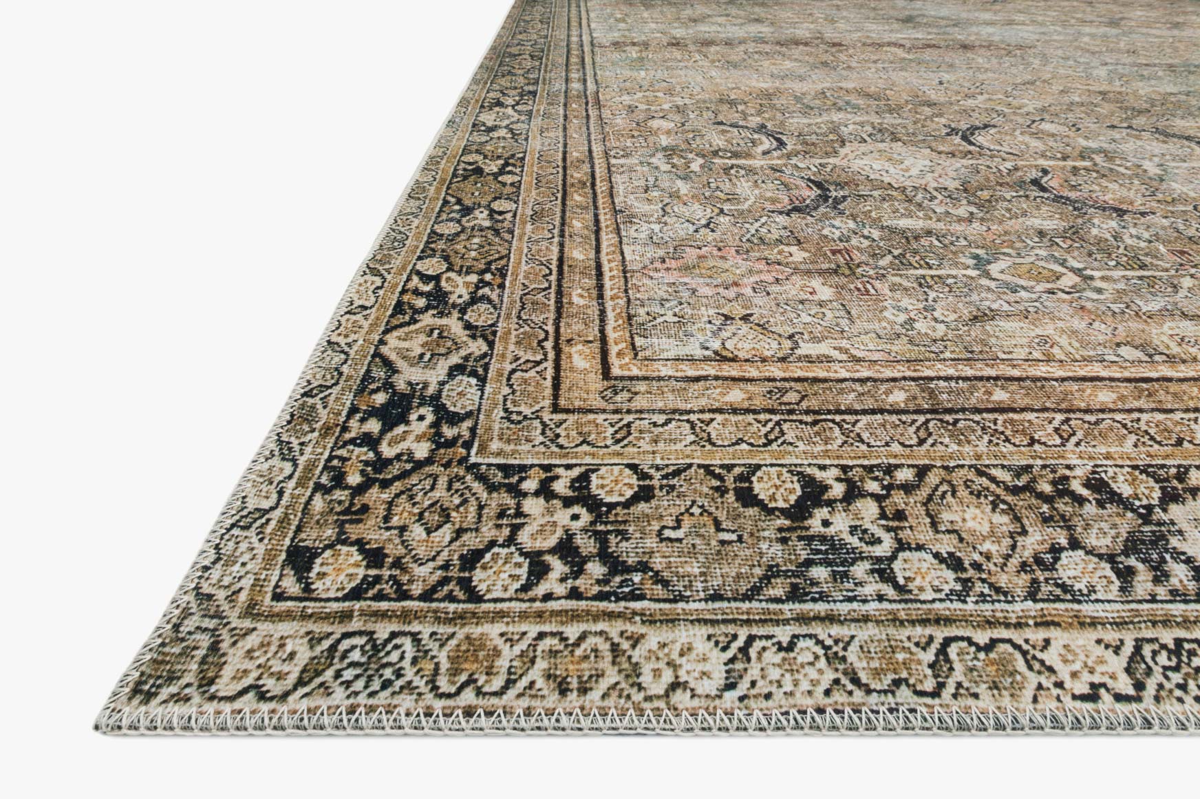 Corner view of traditional power-loomed rug with detailed border pattern, olive and charcoal.