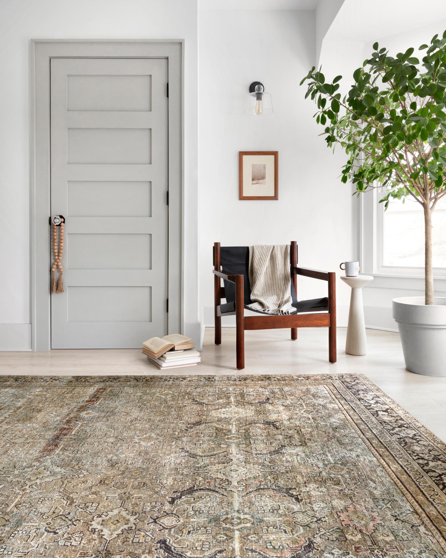 Traditional power-loomed rug with central medallion design and vintage distressing, olive/charcoal.