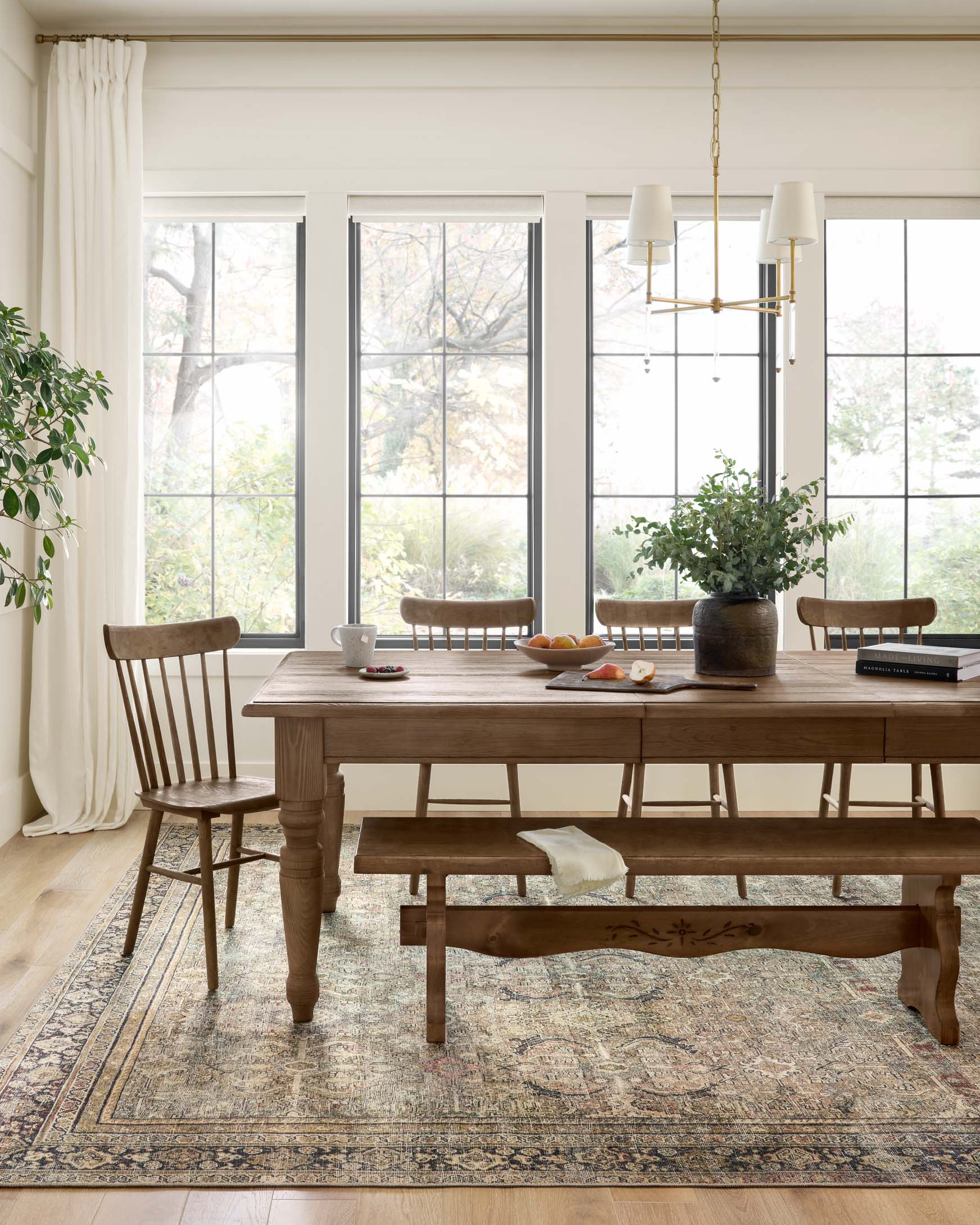 Traditional power-loomed rectangular rug with border and scrolling pattern, olive and charcoal.