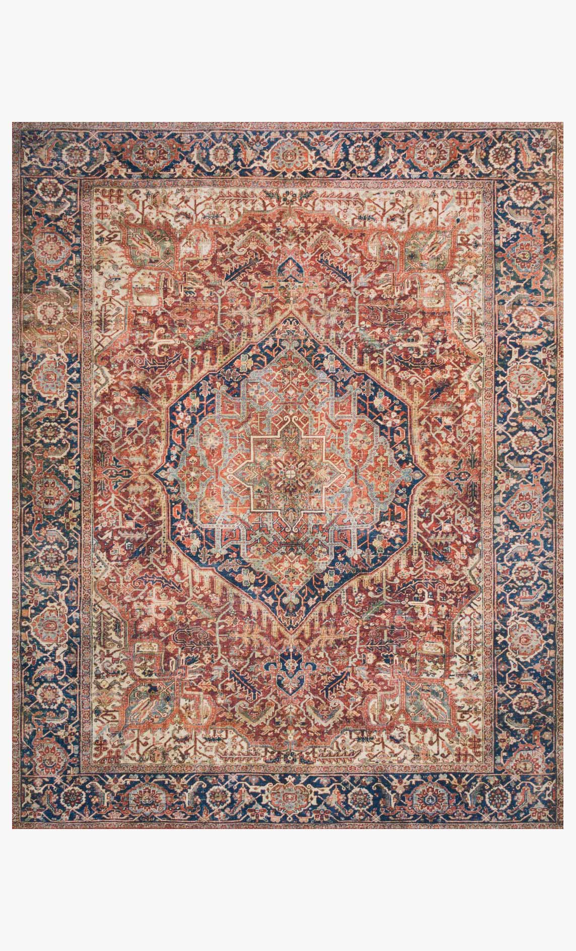 Traditional power-loomed rug with red and navy medallion and ornate geometric border.