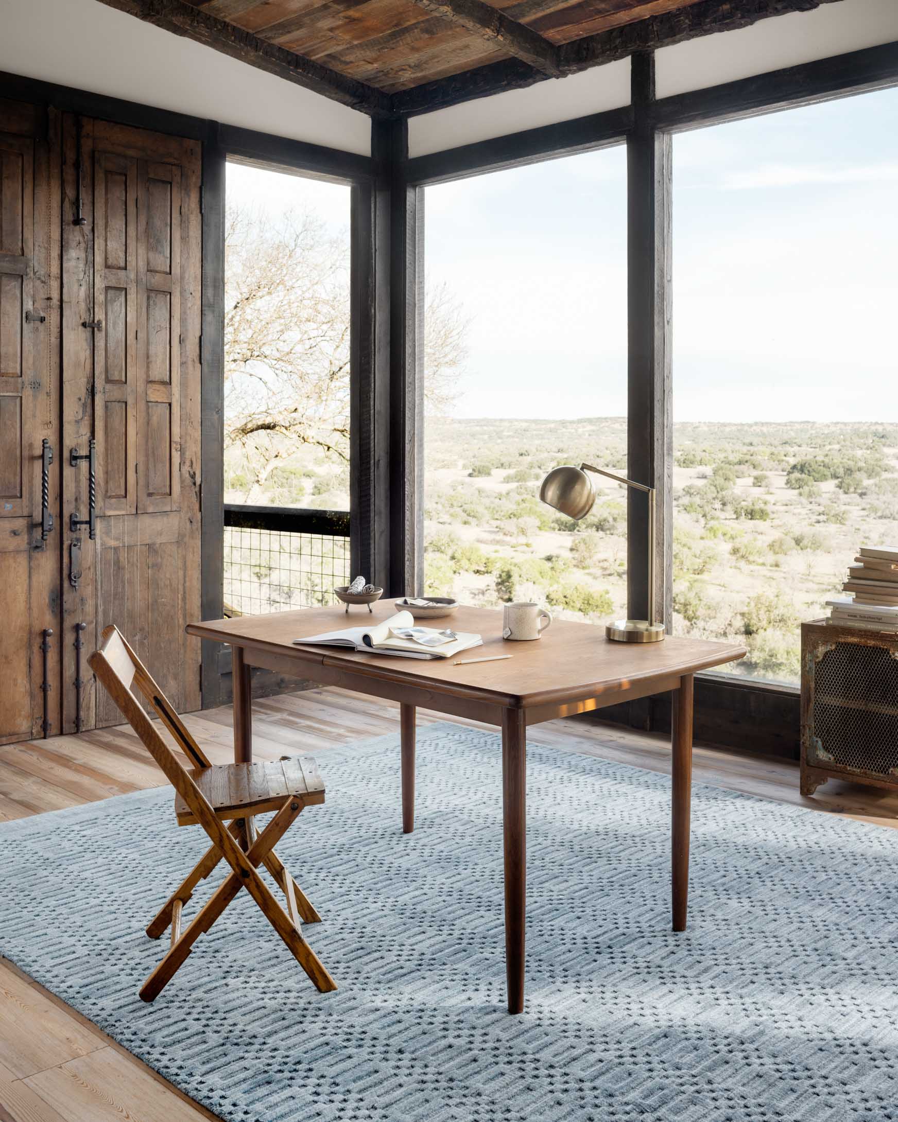 Ocean blue patterned hand-loomed rug with raised geometric weave.
