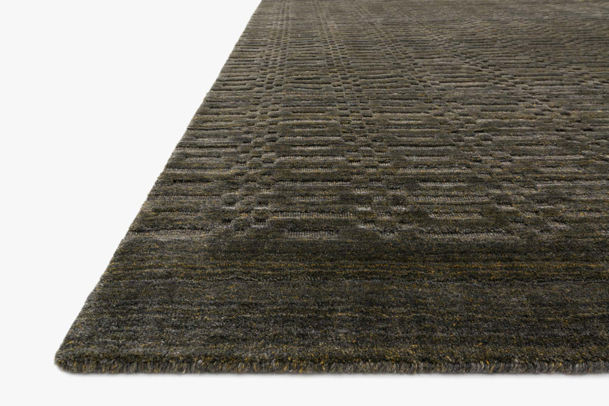 Contemporary hand-loomed rug corner detail, textured flat weave in tobacco and charcoal