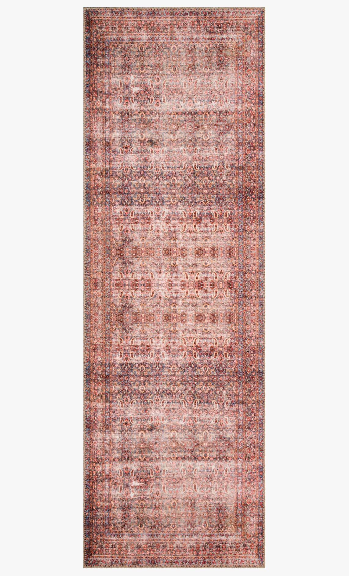 Rectangular traditional rug with distressed red and cream field and patterned border