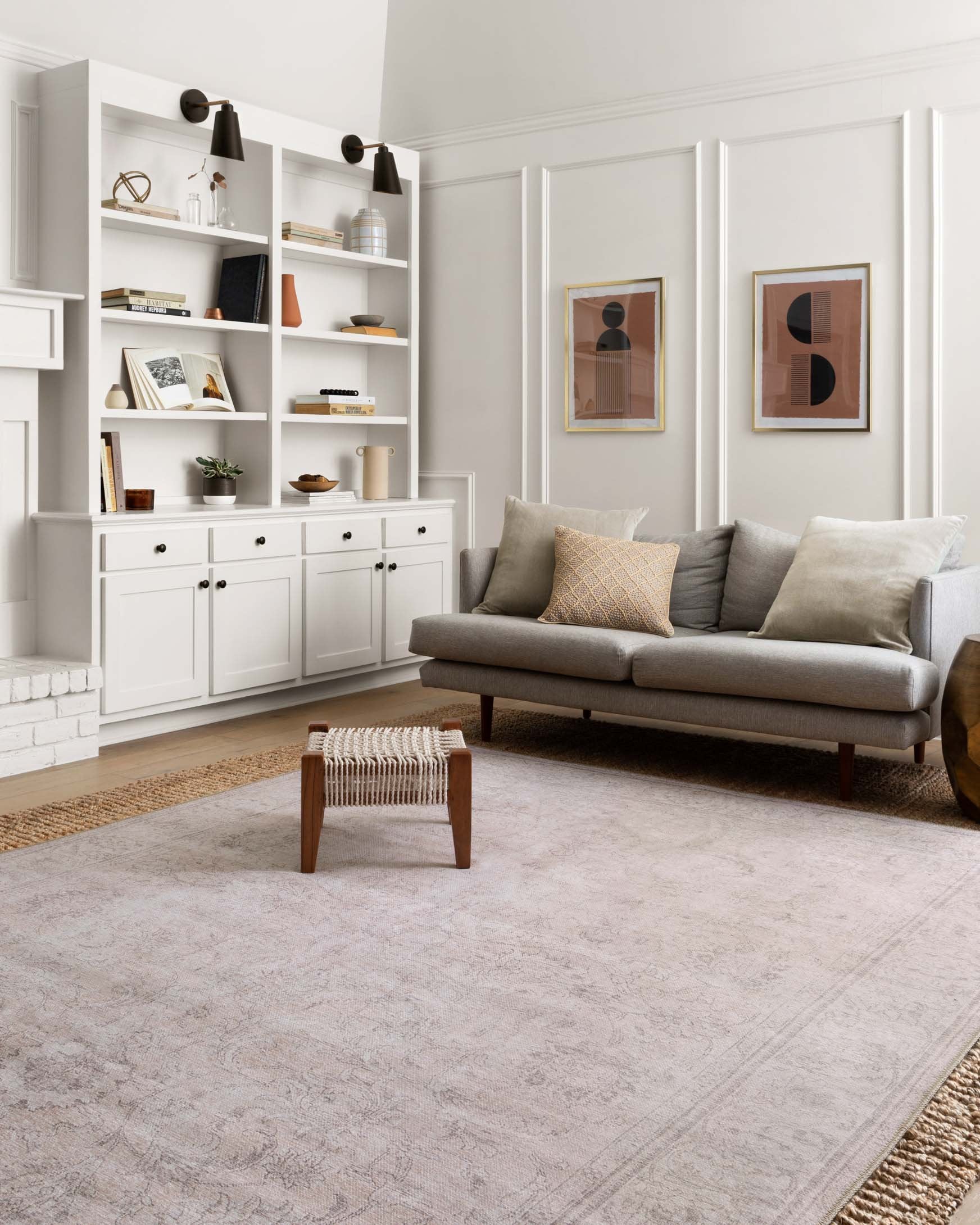 Sand-toned traditional patterned rug laid on floor with visible border detailing