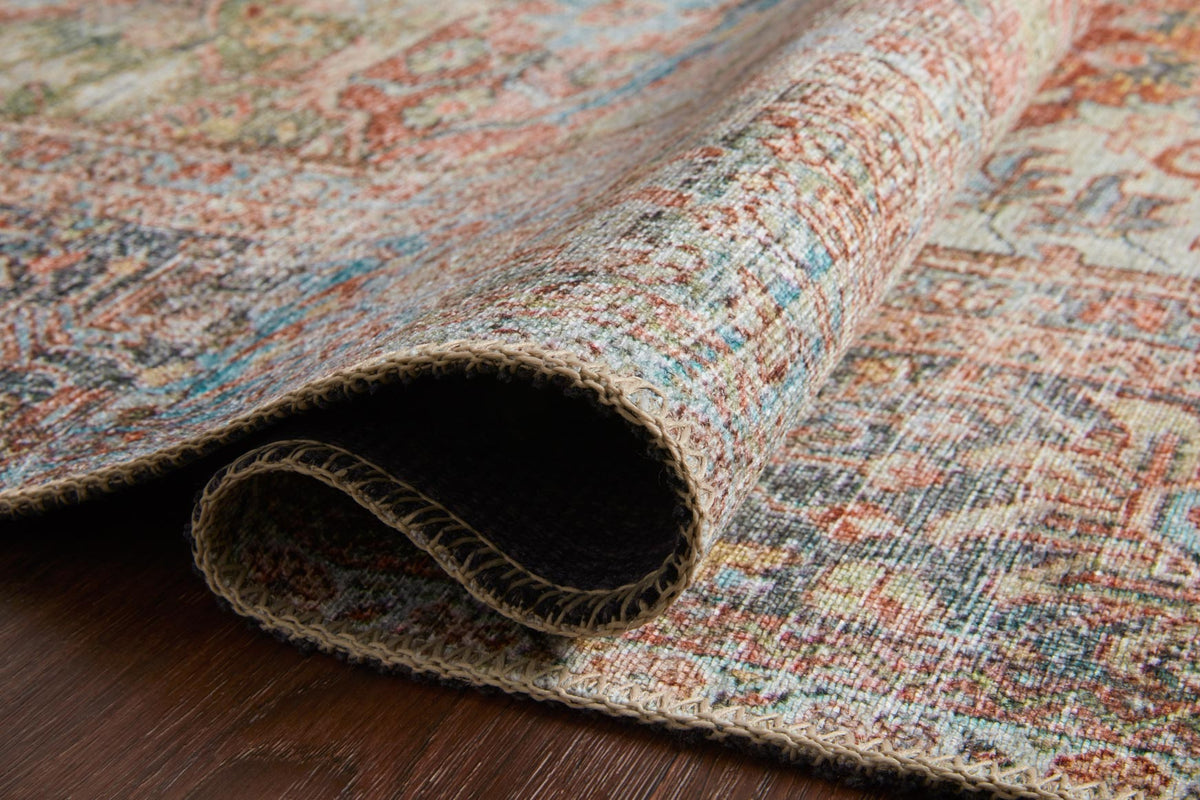 Rug edge and backing texture visible, showing woven construction in dark and light tones.