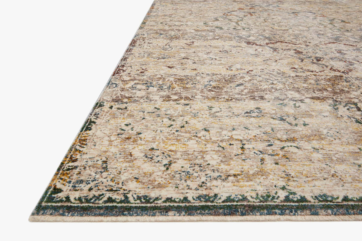 Corner view of ivory traditional power-loomed rug with distressed multicolor pattern