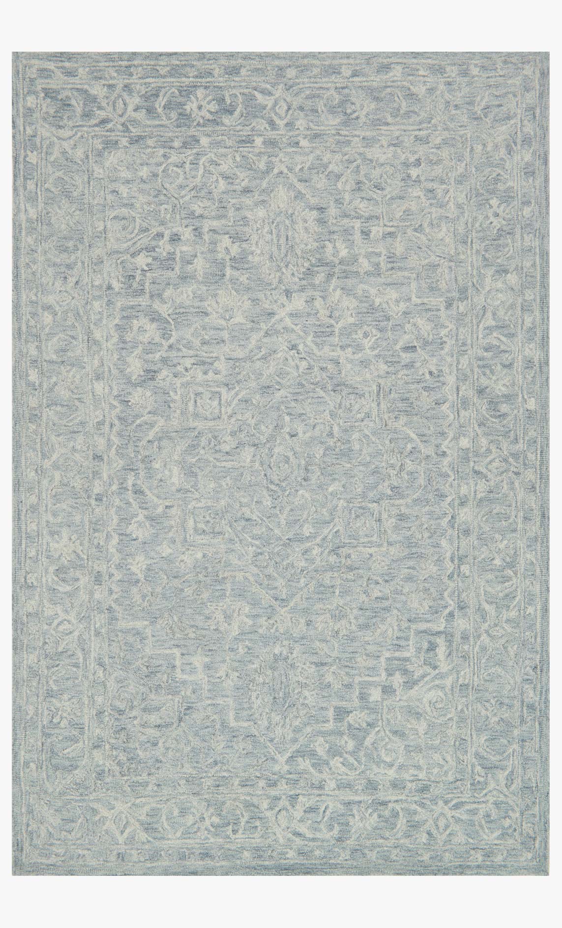 Slate blue hooked rug with ornate tonal geometric pattern, rectangular area rug