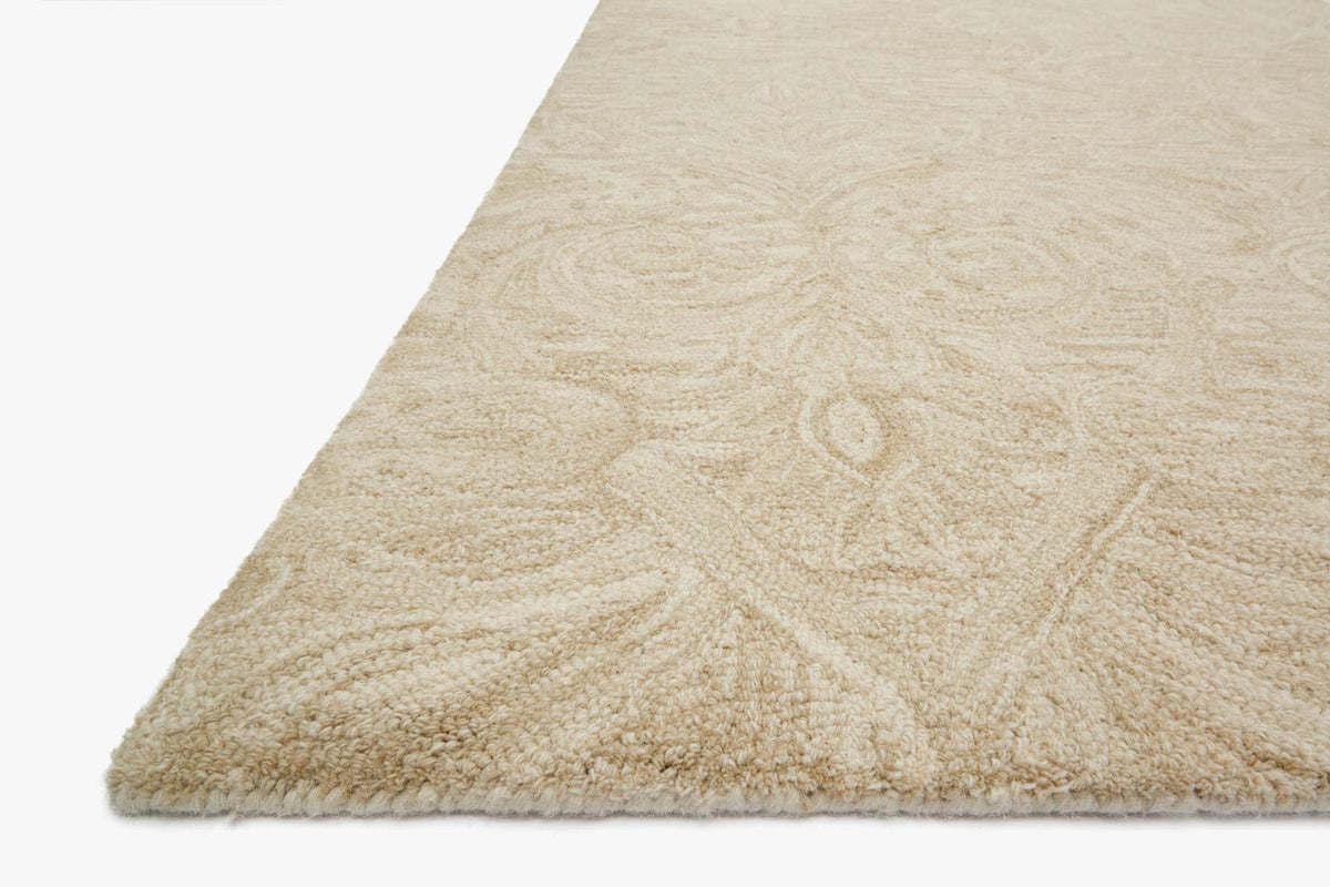 Sand hooked rug corner detail with short fringe and raised scroll texture