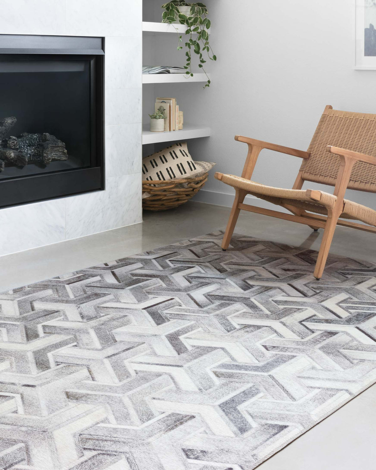 Silver and ivory geometric rug with raised-looking zigzag pattern across the surface