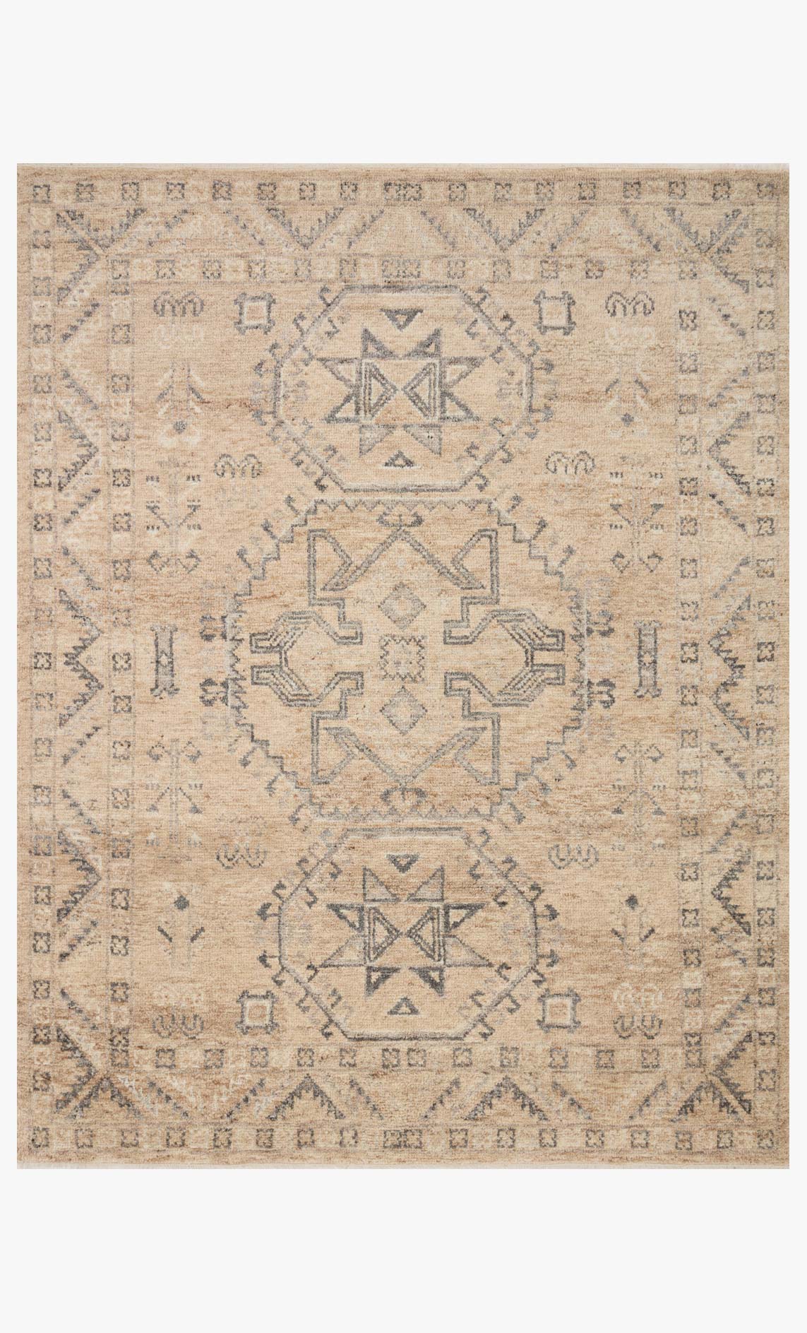 Traditional hand-woven rug in sand with geometric medallion pattern and fringe border