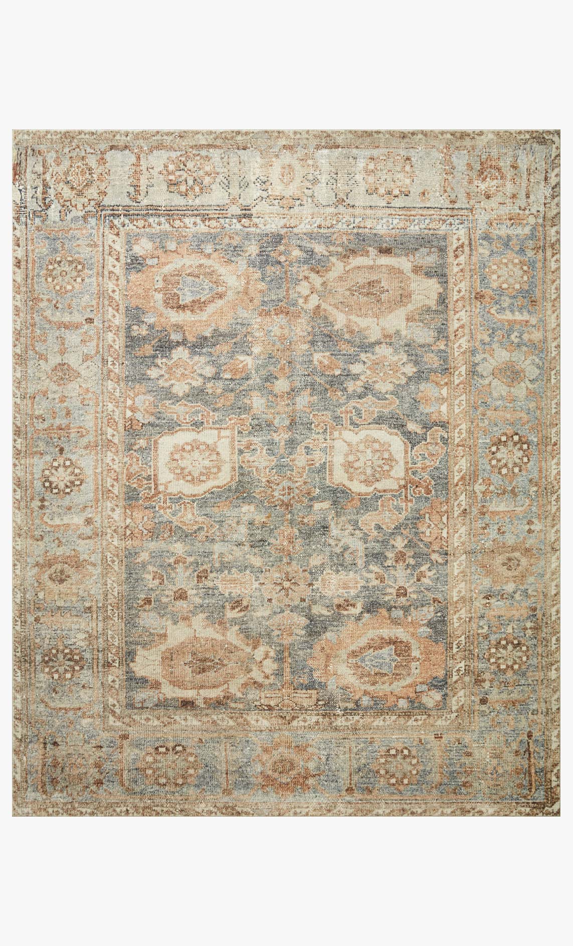 Traditional power-loomed area rug with blue and spice medallion pattern, framed border.
