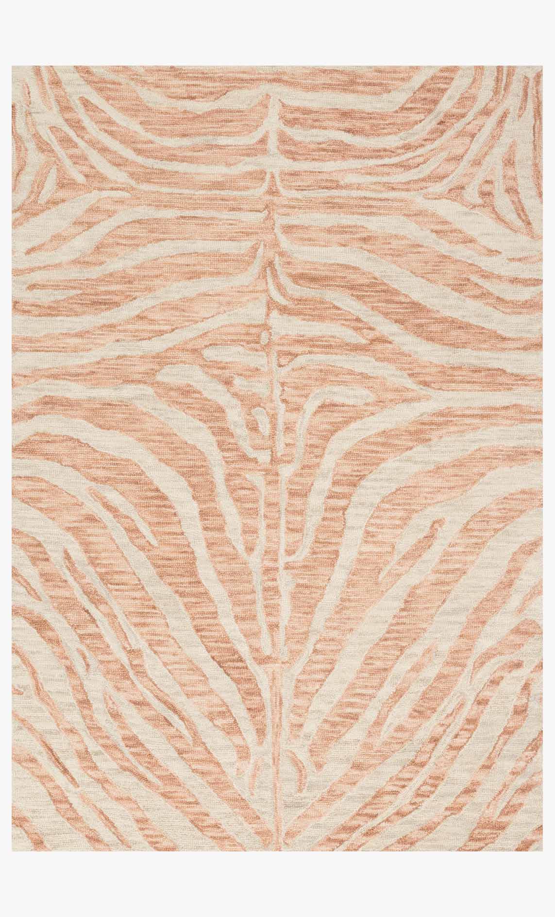 Hooked rug with blush and ivory abstract fan pattern, rectangular pile.
