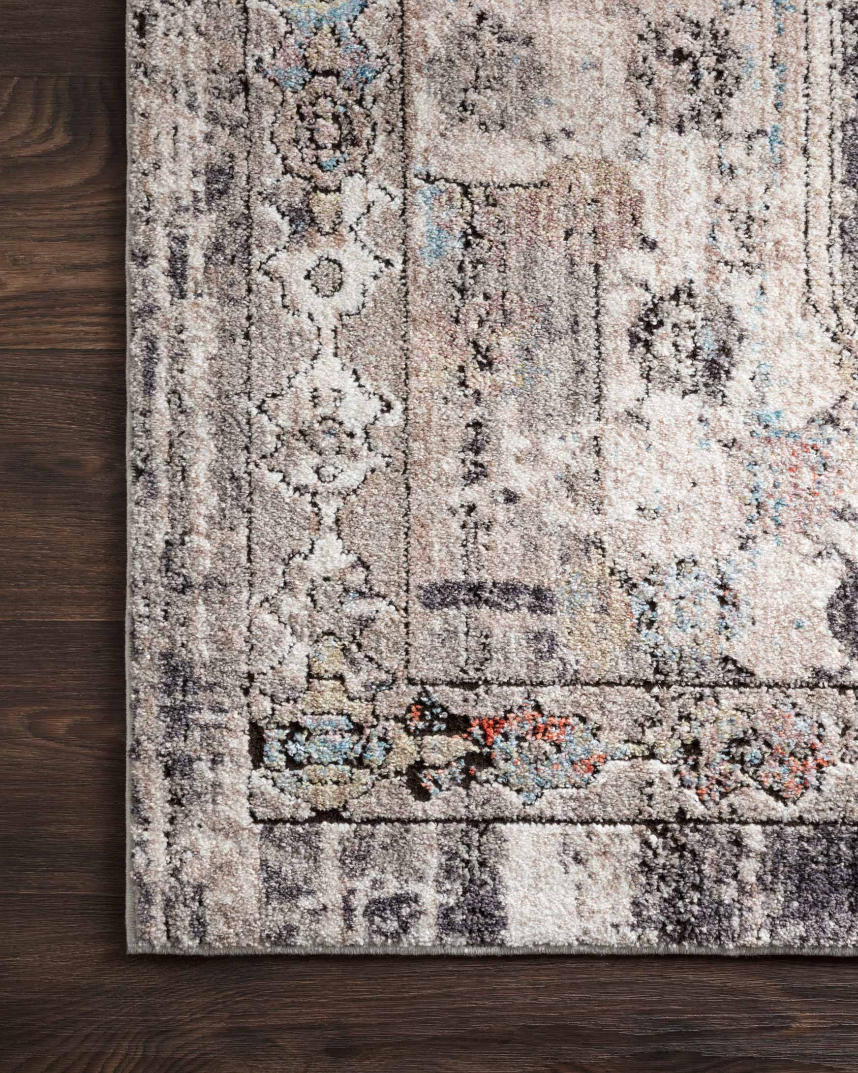 Edge close-up of contemporary power-loomed rug in natural beige and gray with textured pile