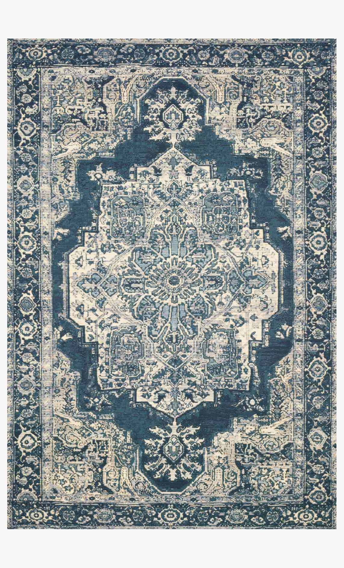 Indoor/outdoor power loom rug, dark blue with light medallion and ornate border.