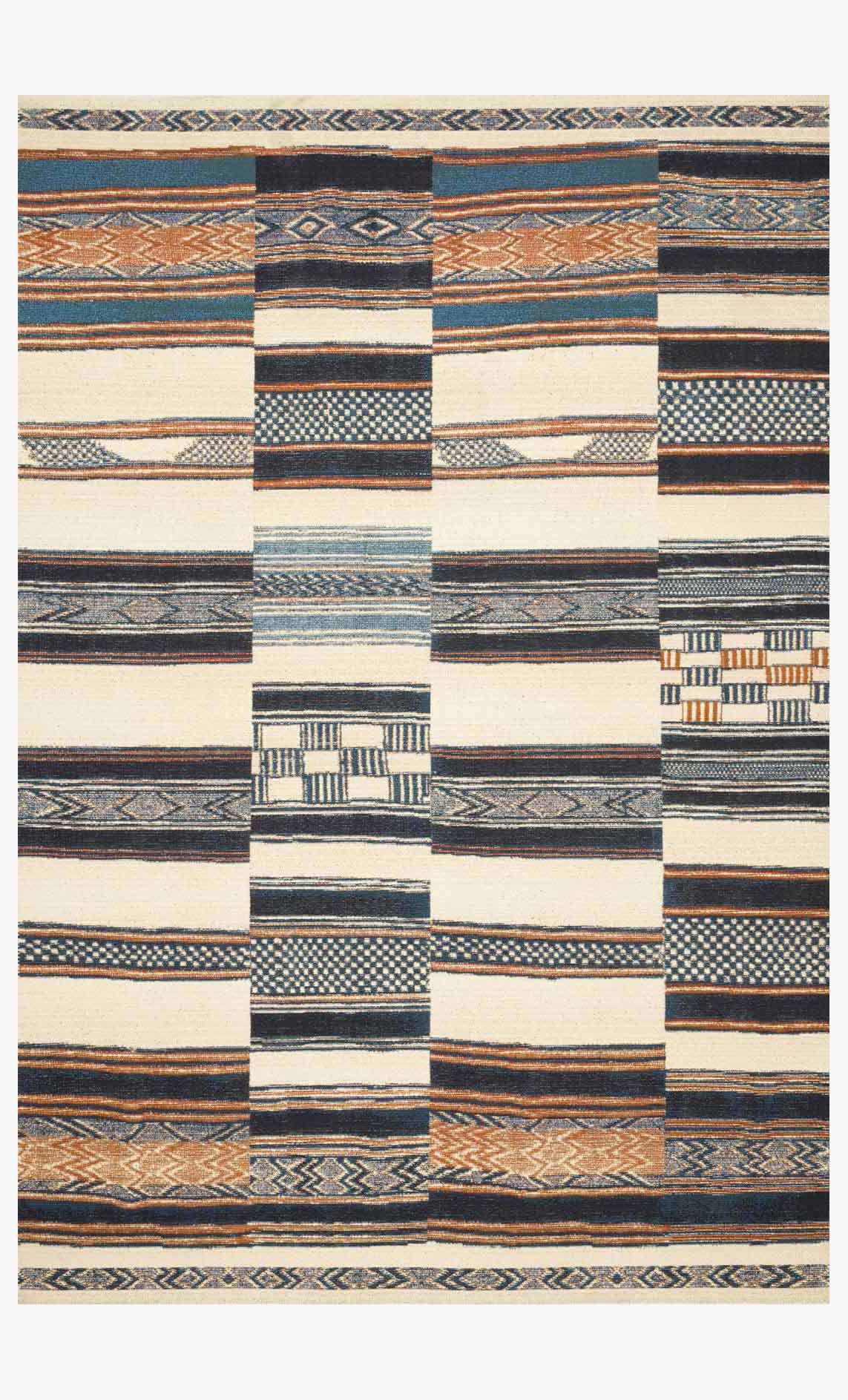 Ivory indoor/outdoor rug with geometric patchwork stripes in blue, navy, and orange