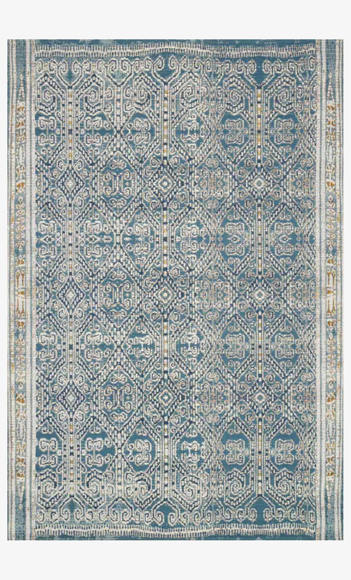 Ocean blue indoor/outdoor rug with ornate geometric medallion pattern and border