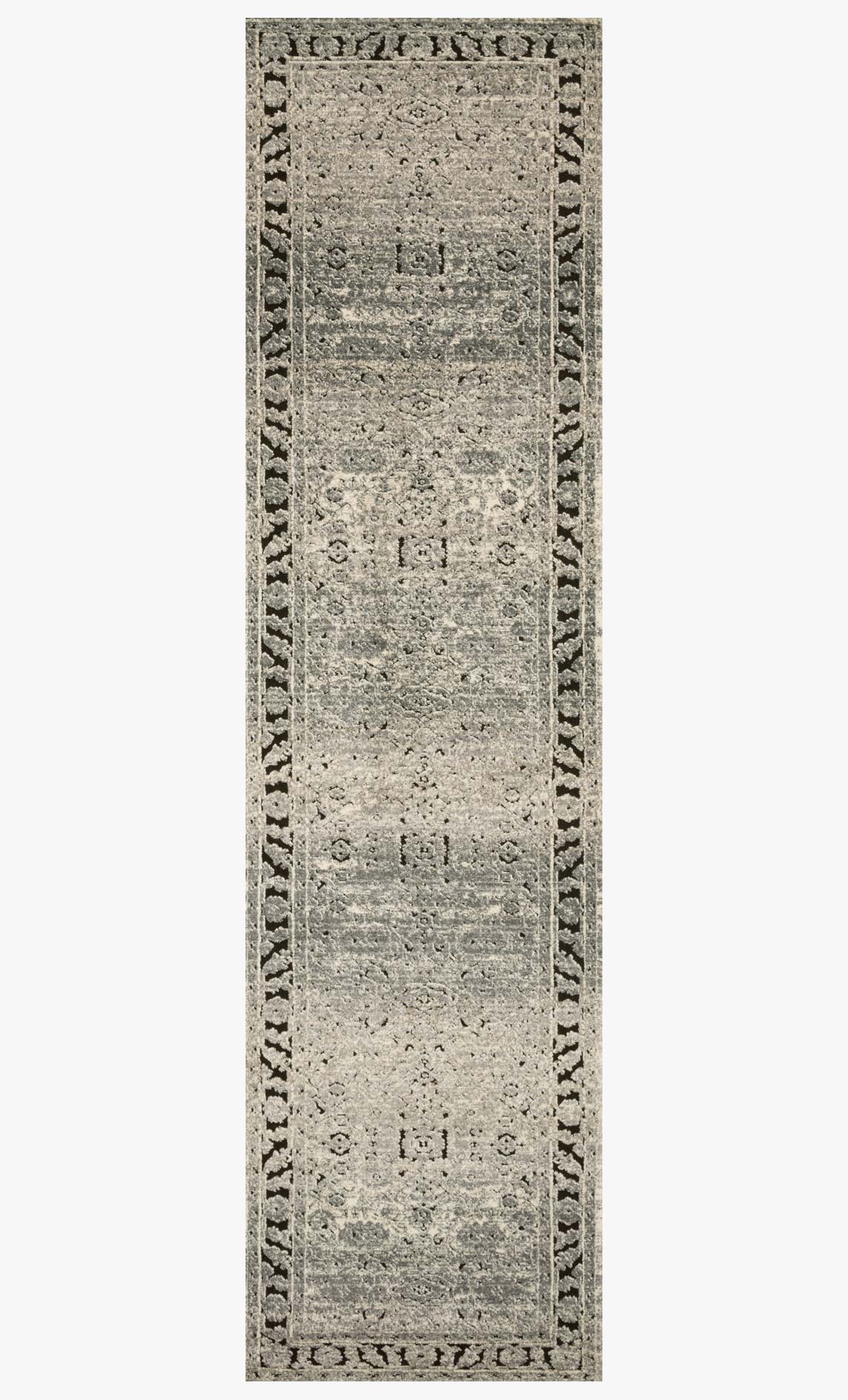 Rectangular grey and charcoal rug with distressed texture and repeating border motifs