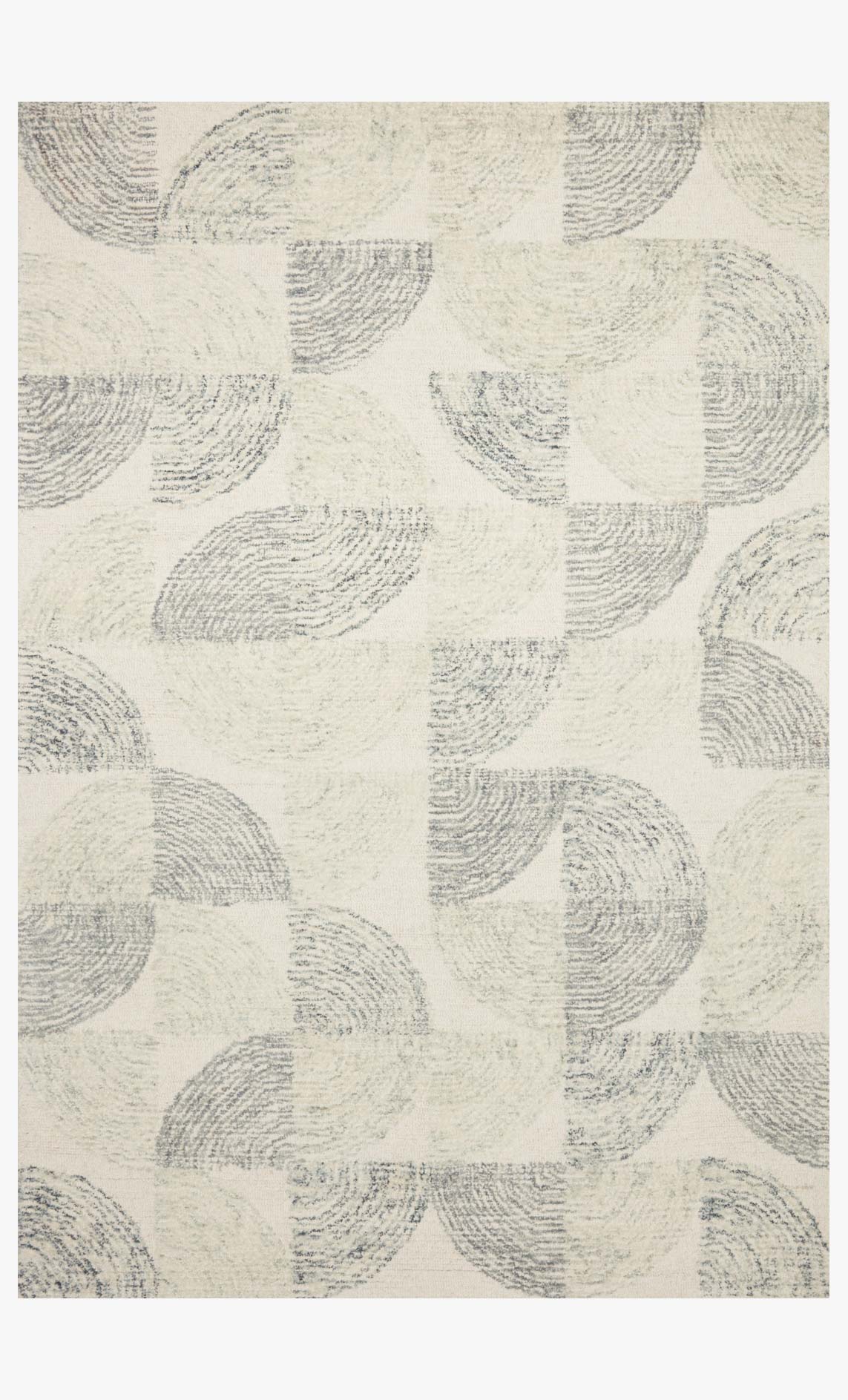 Hand-tufted rug with slate-blue abstract circle pattern on cream ground