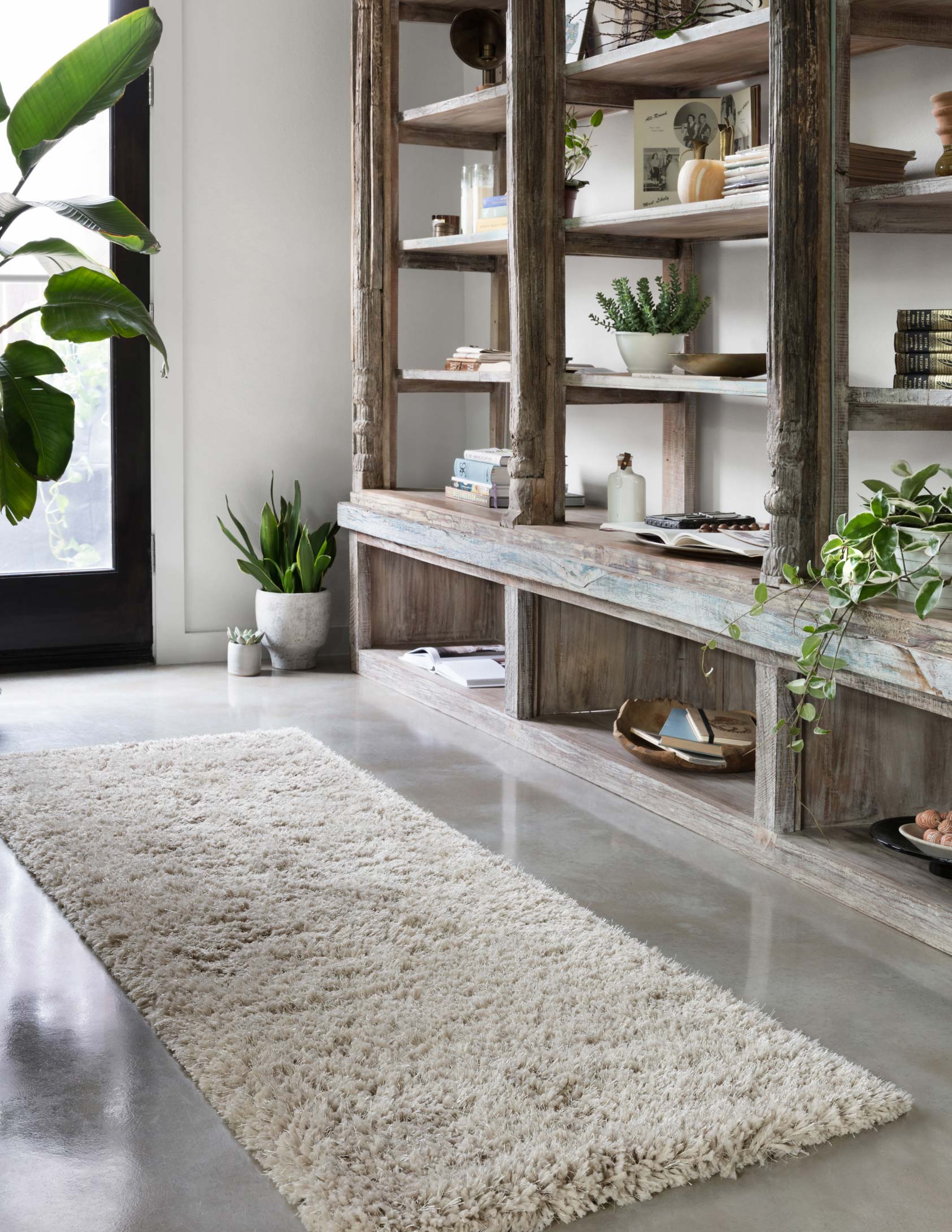 Grey shag runner rug with dense high pile and stitched edge detail.
