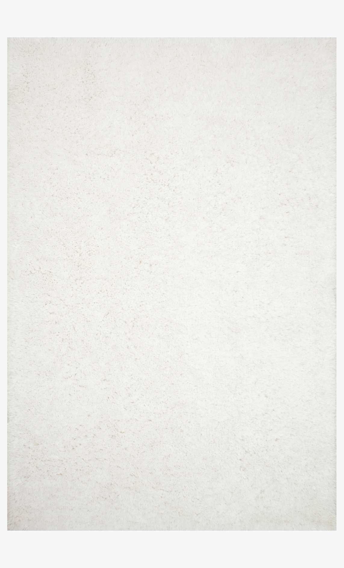 White hand-tufted shag rug with dense, plush pile texture