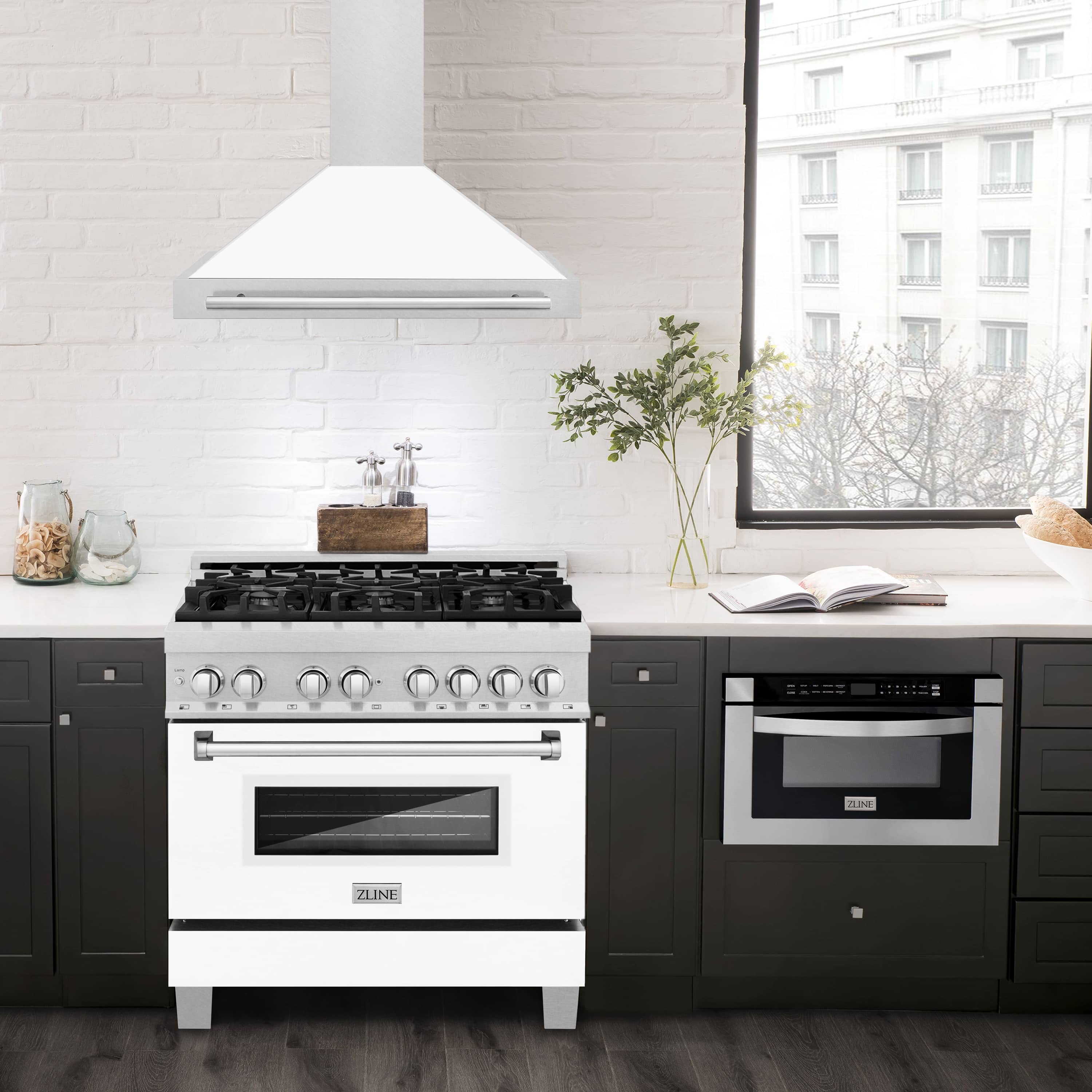 Wall-mounted range hood over a kitchen stove, white matte chimney and satin stainless steel