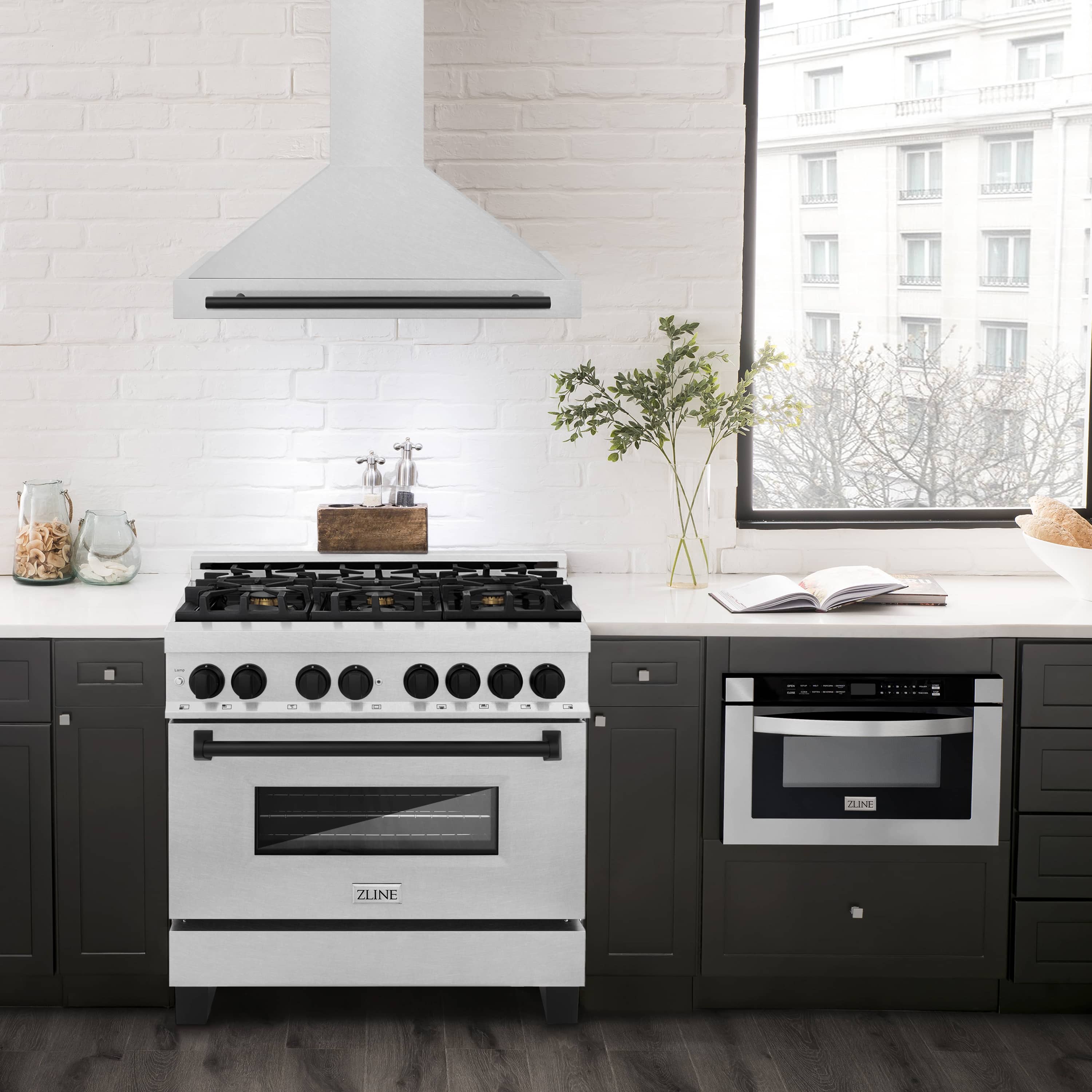 Wall-mounted range hood over cooktop, white stainless with matte black handle