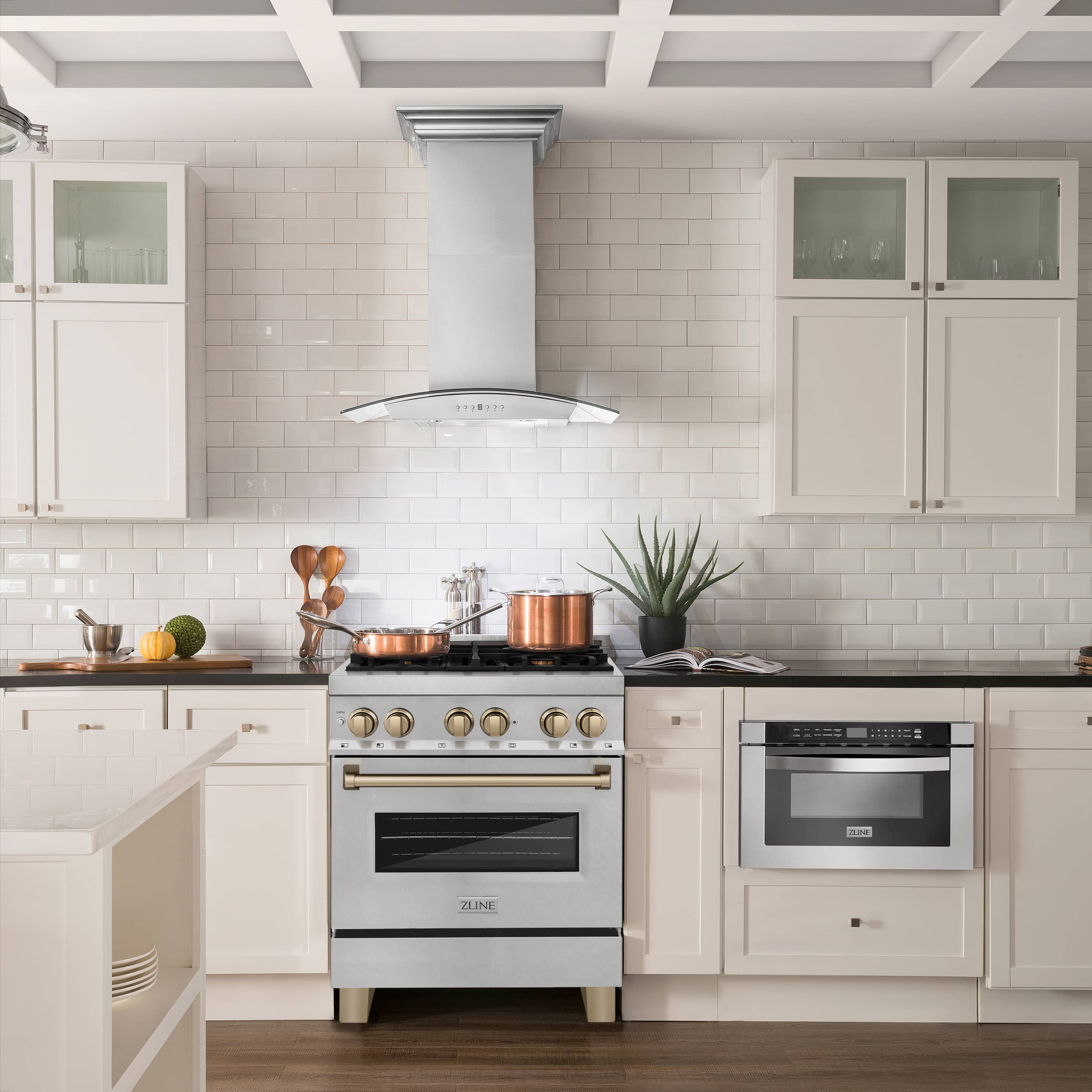 30-inch dual fuel range in satin stainless with champagne bronze knobs and gold handle