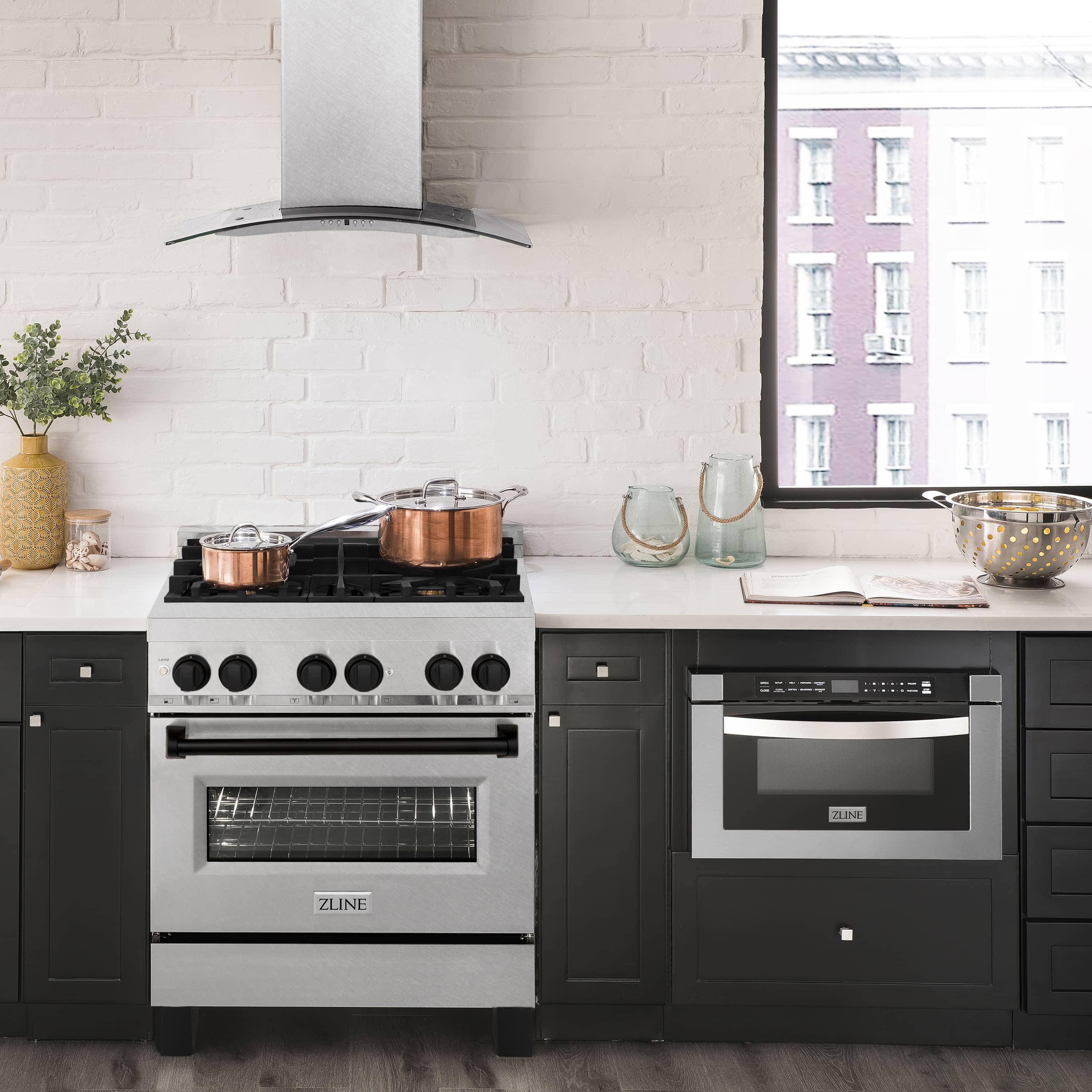 Dual fuel range with stainless steel oven and black control knobs, gas cooktop with grates