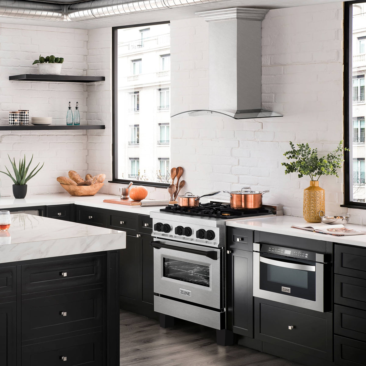 Dual fuel range in satin stainless with matte black accents, gas burners and two oven doors
