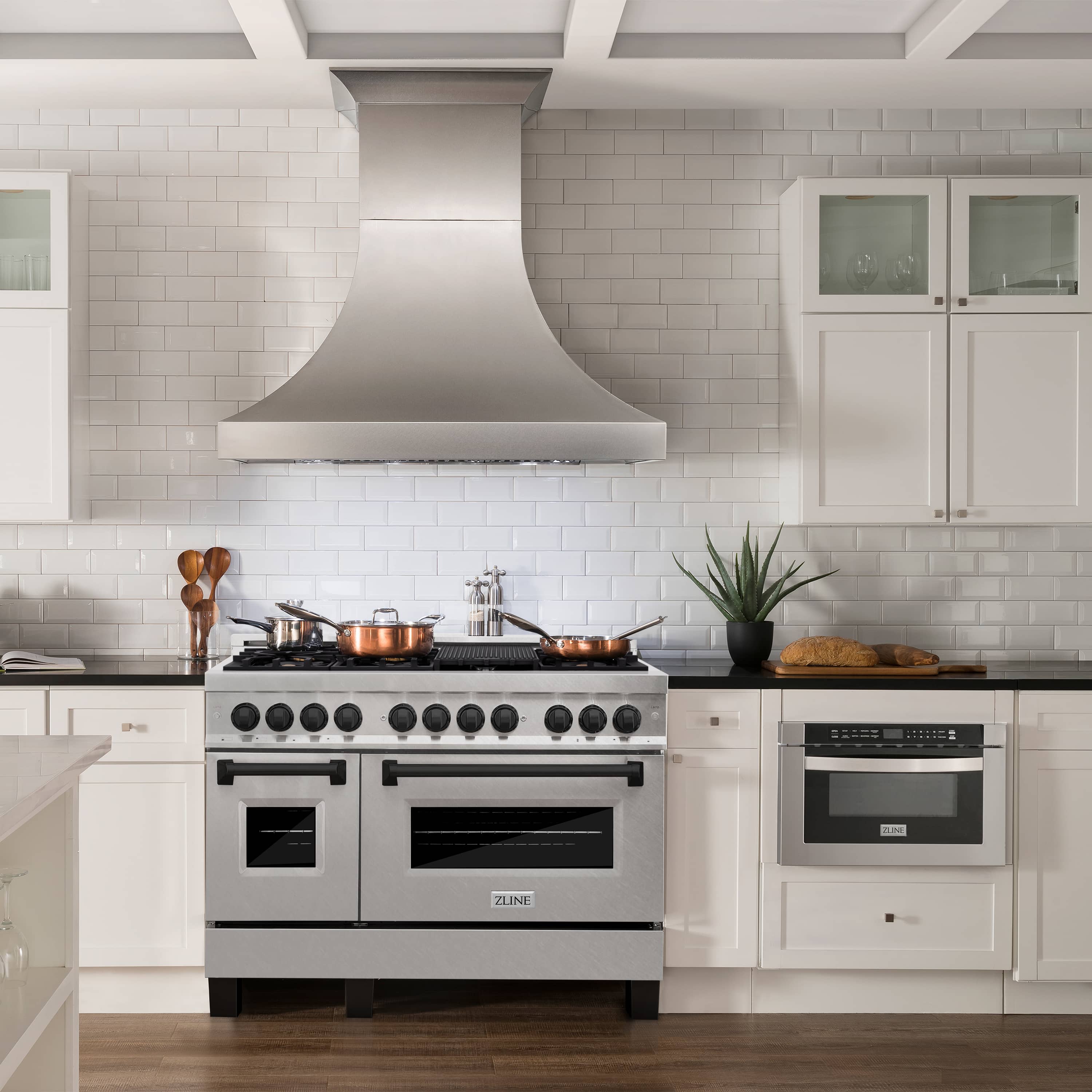 Dual-fuel range with fingerprint-resistant stainless body, black cooktop, and double ovens